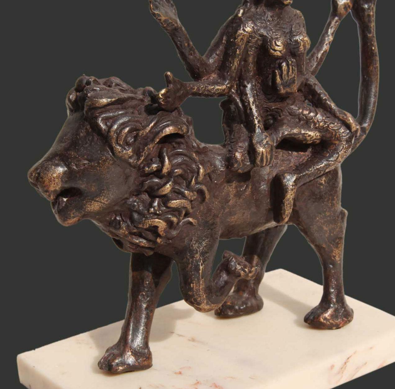 Seema Kohli - Shakti II  - H 7 X L 7.5 X W 3.5 inches
Bronze sculpture.

Seema draws her works from the rich Indian Tradition, myths and mythology and folklore. 
Here her mythological Goddess is perched on her carrier, the beautiful king of the
