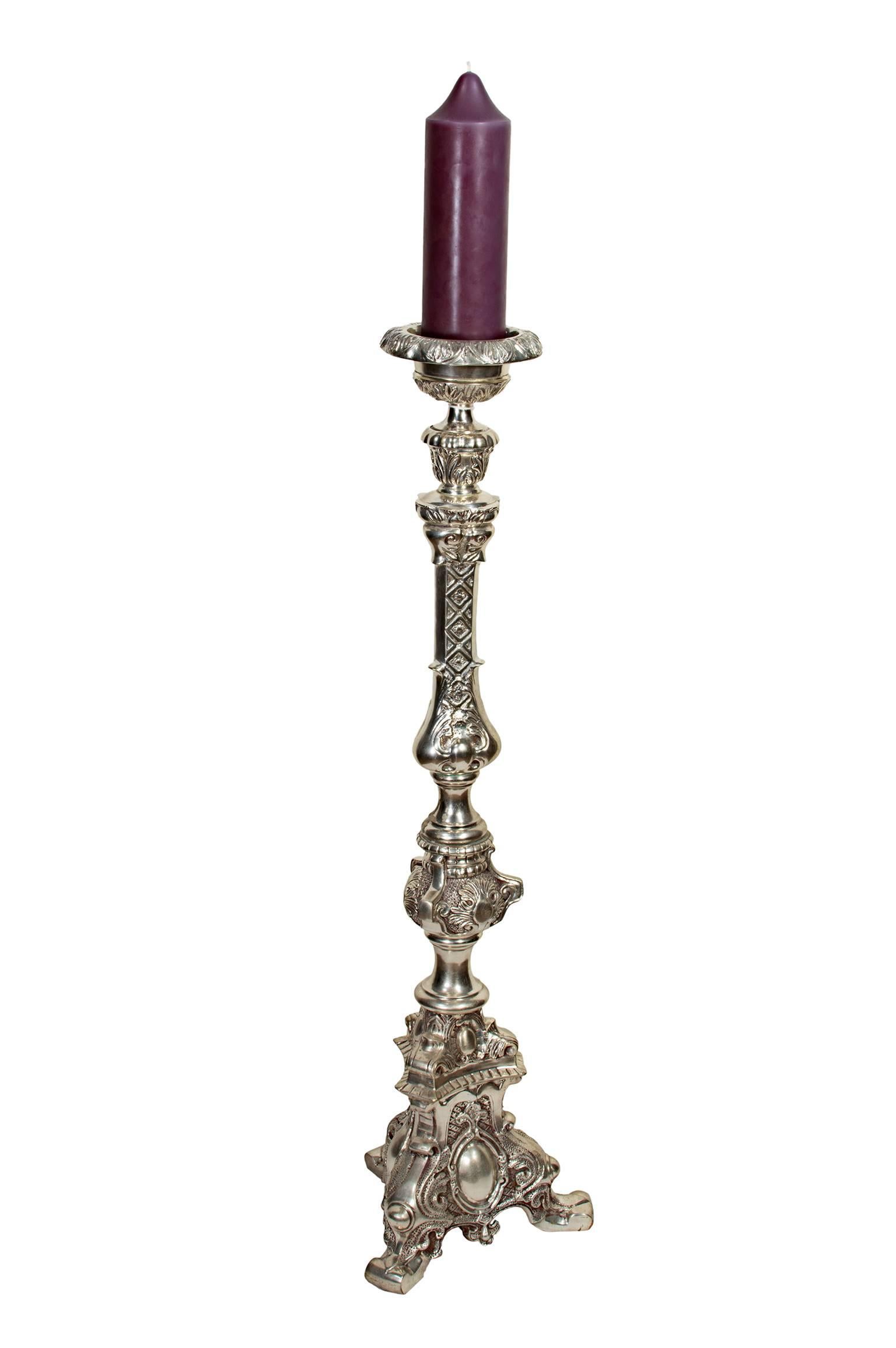 This pair of silver-plated candlesticks were created by an unknown artist in 2000.