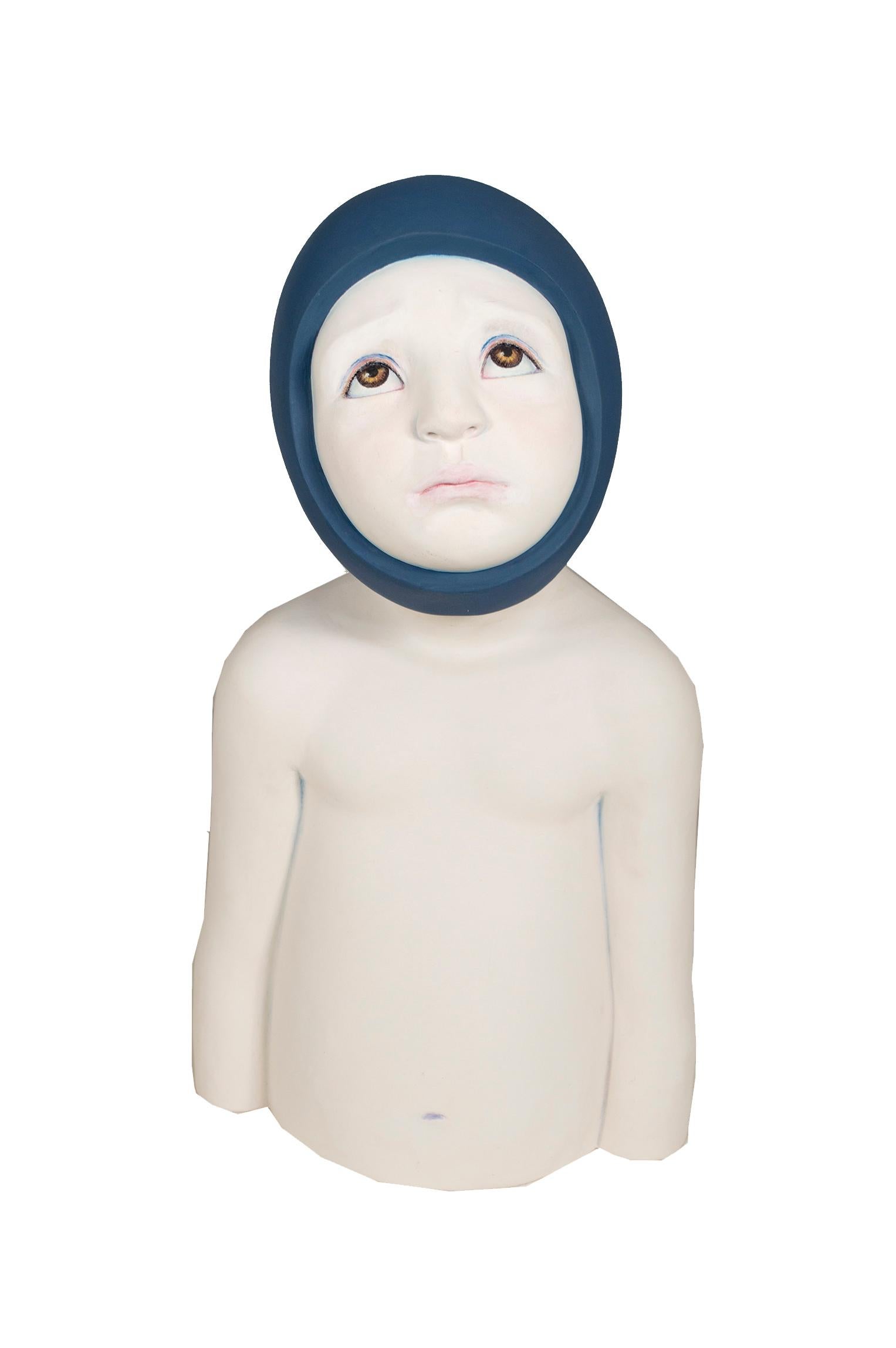 "Looking For" is a ceramic bust of a small child signed on bottom by Orly Montag. The child looks upwards sadly, almost pouting. His body is purely white except for around the face, pink cheeks and lips, as well as big brown eyes, and blue eye lids.