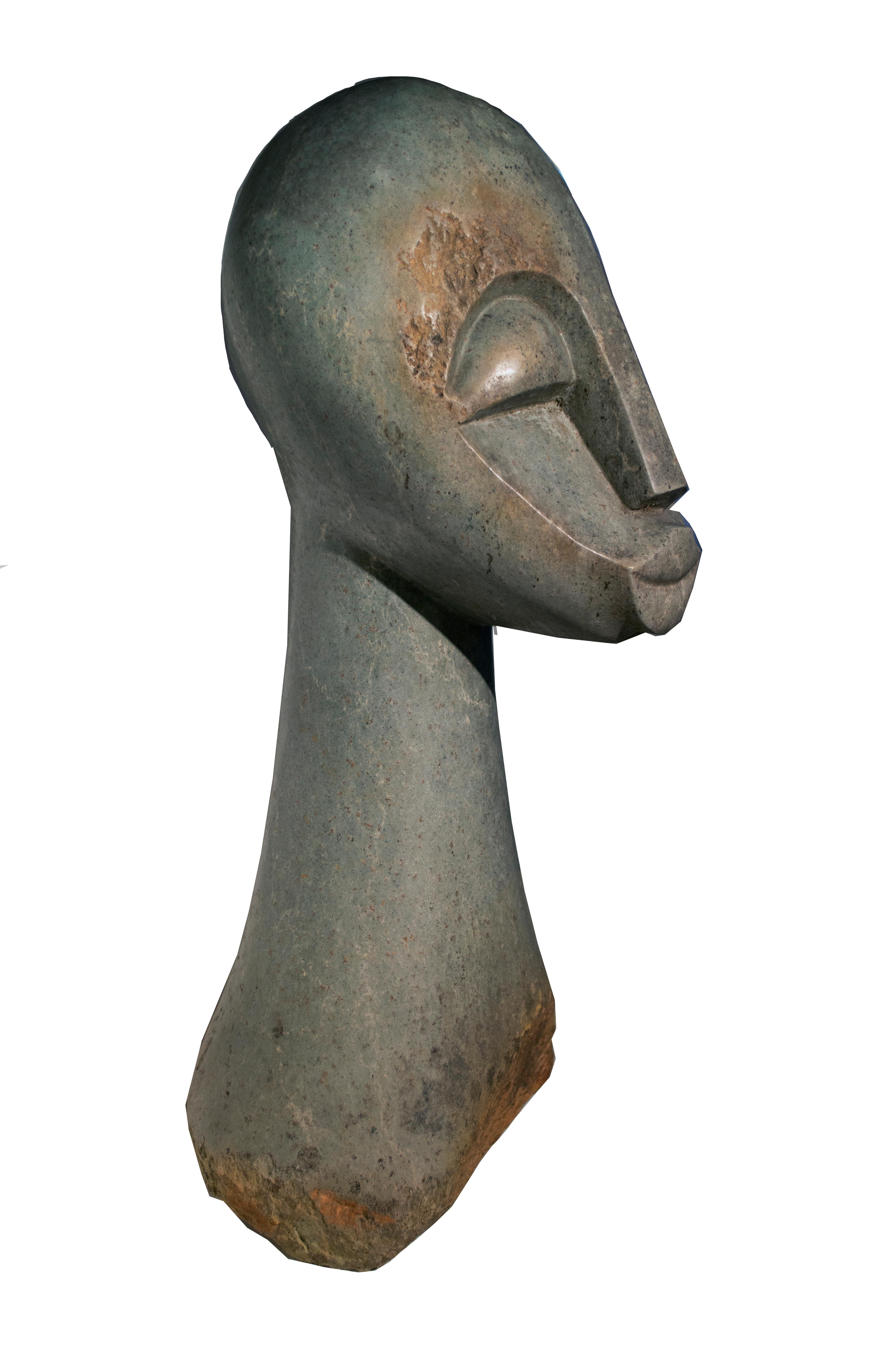 "Head" is an opal sculpture signed by Joseph Makenzi an African Shona.  The head is very peaceful and happy. Their lips turn up at the corners and eyes closed. 

Art: 24 x 8 x 10 in