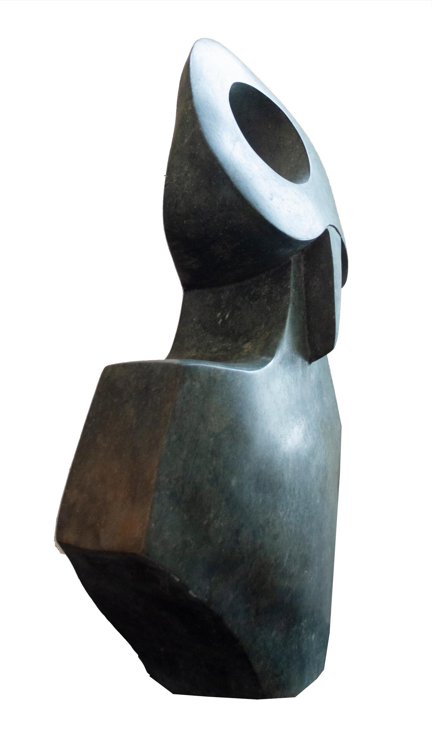 'Owl' is an original opal serpentine stone sculpture signed by the contemporary Zimbabwean artist Joel Nhete. The artist presents in this sculpture a highly abstracted figure of a wide-eyed owl, its eyes like rings and its beak like a needle. The