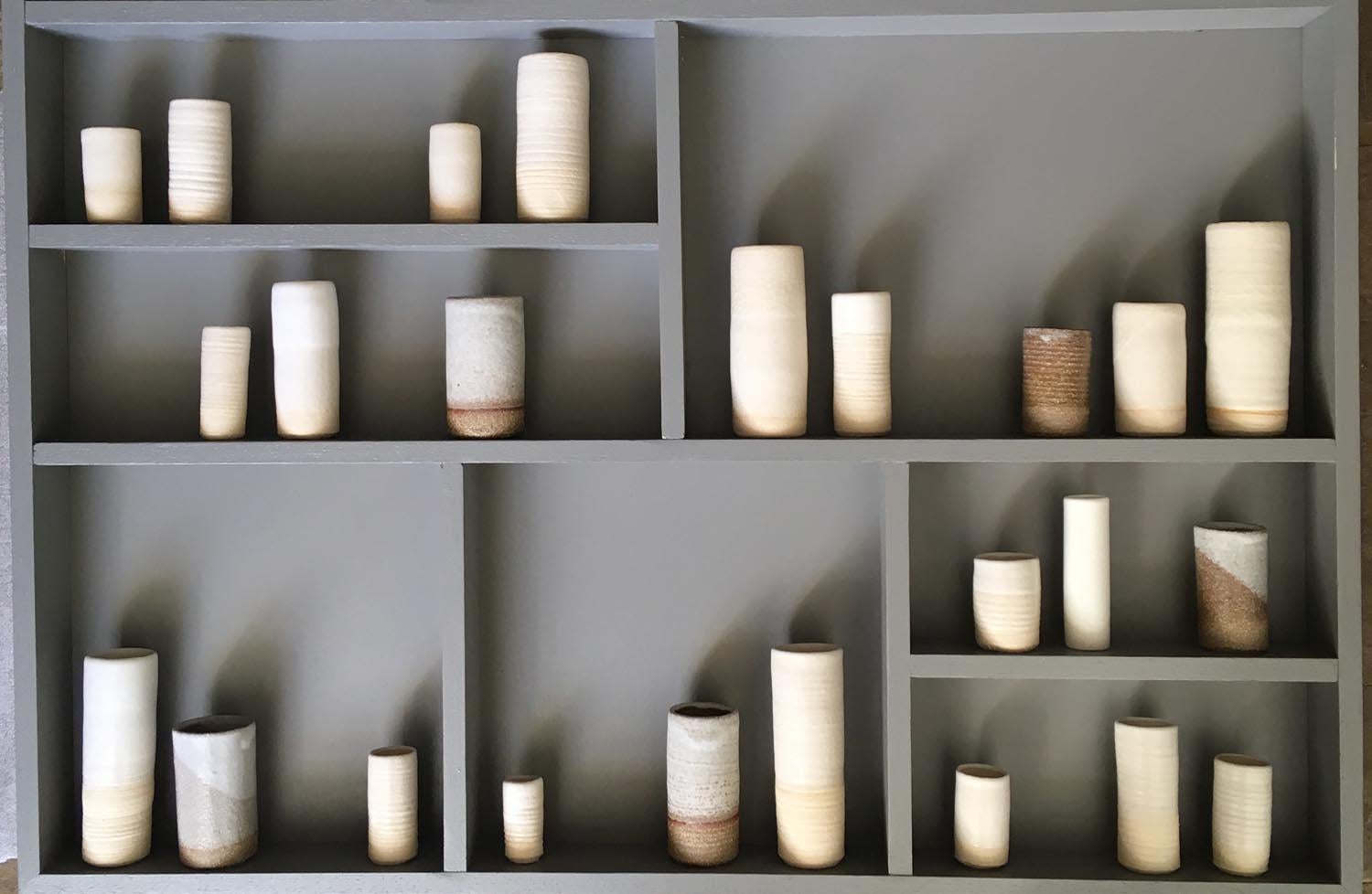 Emma Bell’s ceramic and porcelain Pot Frame – Installation Piece.
Emma Bell says: “This piece is inspired by my glaze test vessels. As a potter, I am always staggered by how different the same/similar glaze turns out on different clay bodies when it