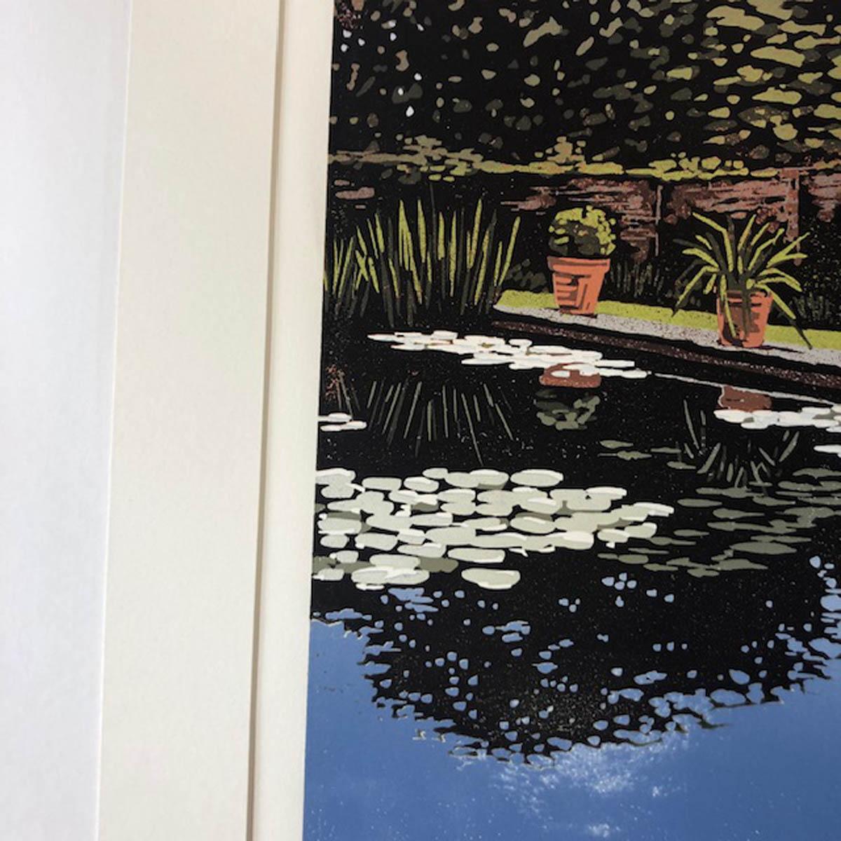 Created in 2018 by Alexandra Buckle.

A large reduction linocut of a walled garden and lily pond with reflected trees. This is printed in nine layers of colour and is a small edition of 10 prints, all of which are printed by hand so small variations