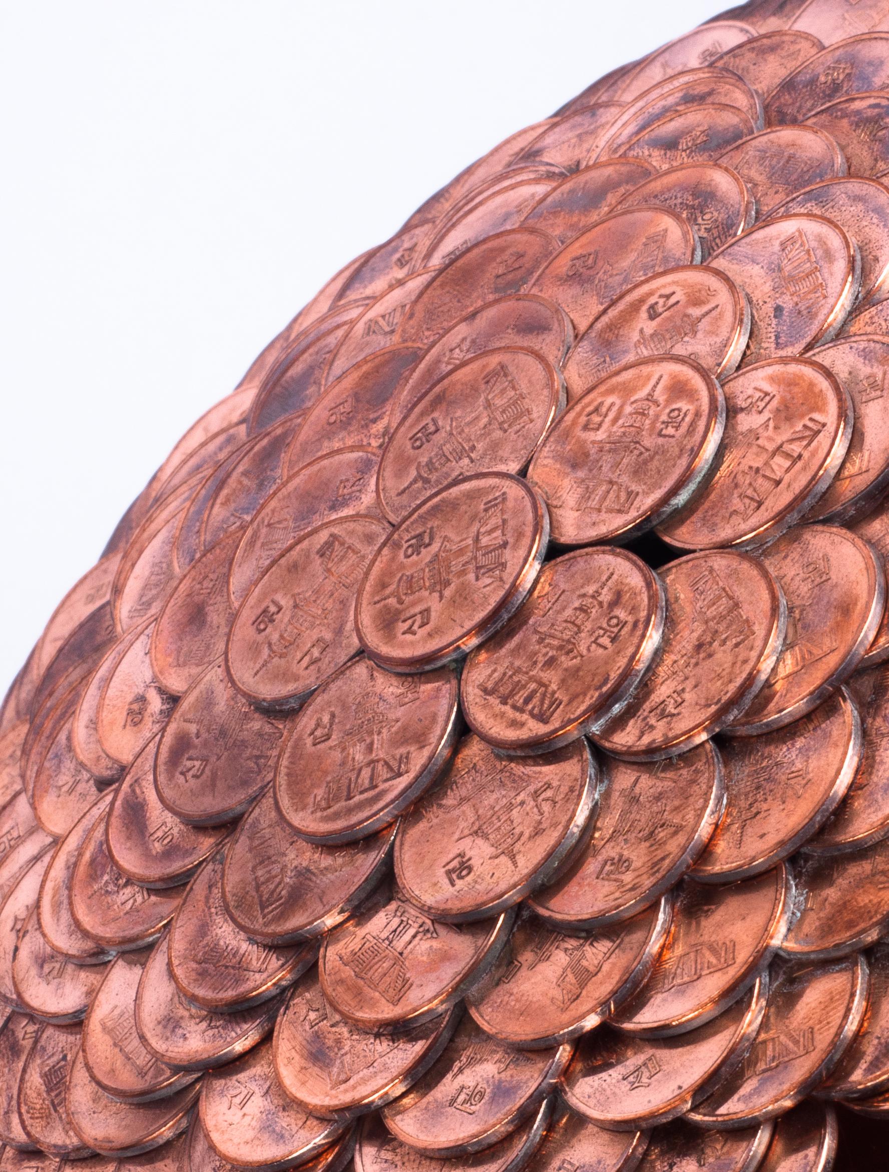 Kinetic sculpture made from coins 