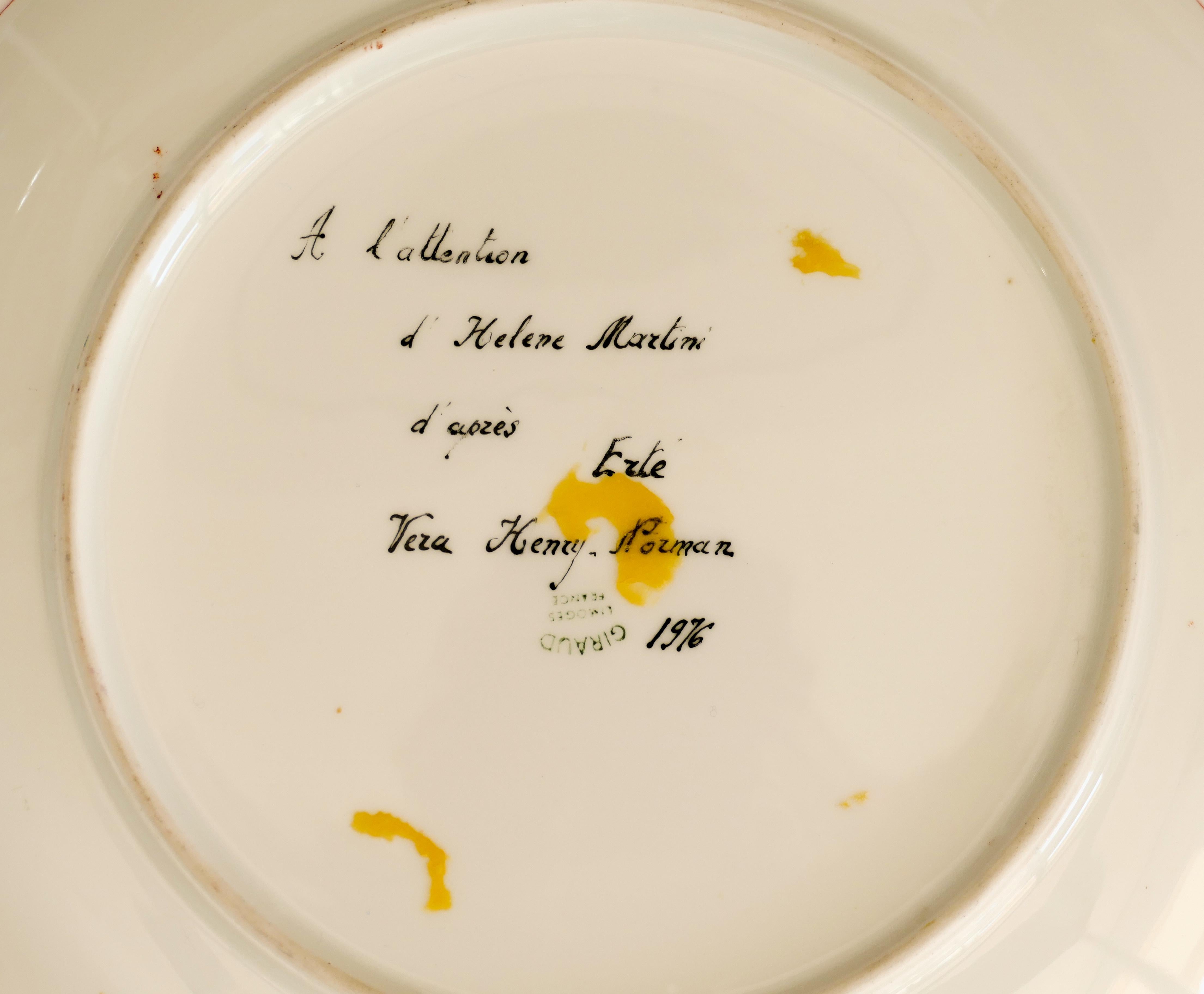 Á l'attention d'Hélène Martini Plate is an original decorative porcelain plate realized in 1976.

This very rare plate reproduces a sketch of a male portrait on a red background by Erté (Romain de Tirtoff) and on the back a signed and dated