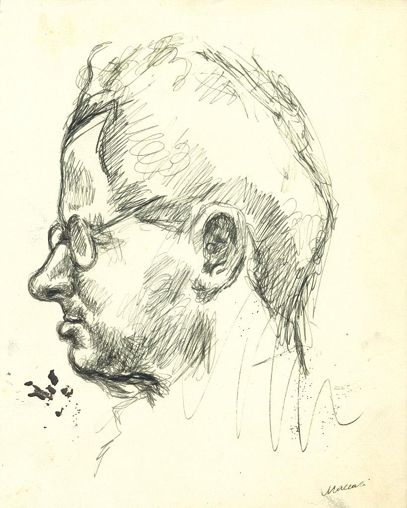 man with glasses drawing