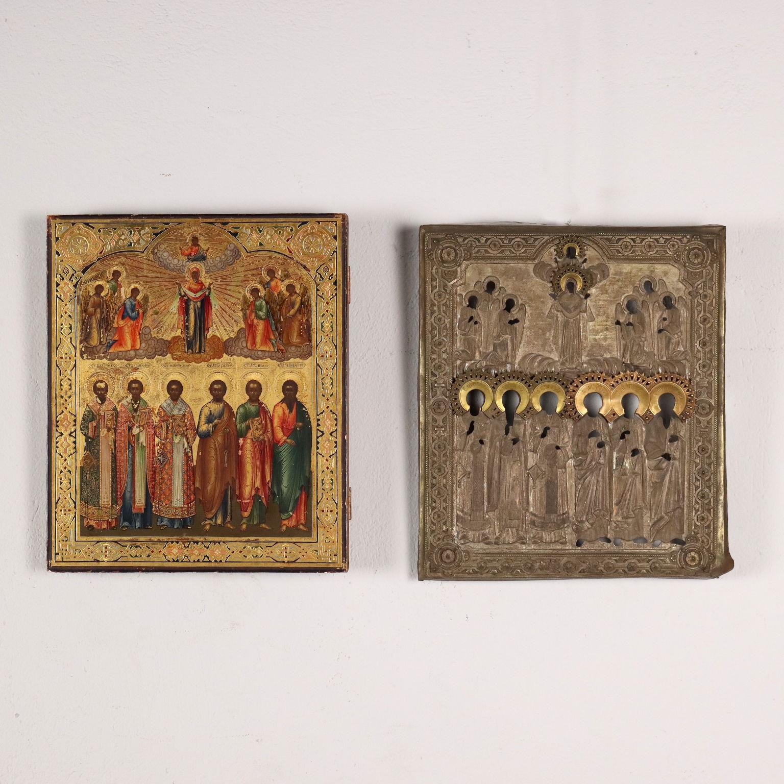 Tempera on wood with metal riza, gilded in correspondence with the halos. The icon sees in the lower half a group of six saints, whose name is indicated in Greek characters, while in the upper part there are Mary and Jesus in Glory, flanked by