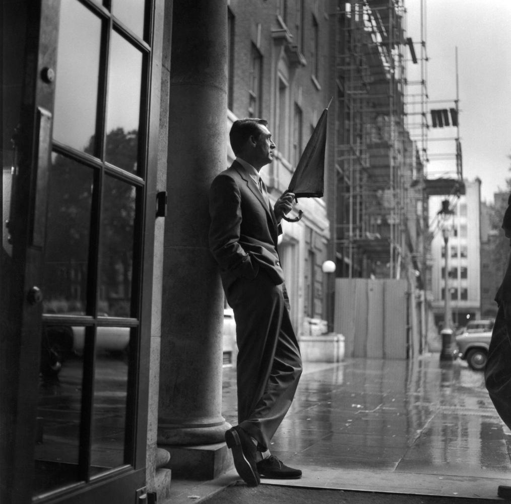 Unknown Black and White Photograph - Cary in the Rain, 1957 - 20th Century Photography, Cary Grant, Hollywood Photo