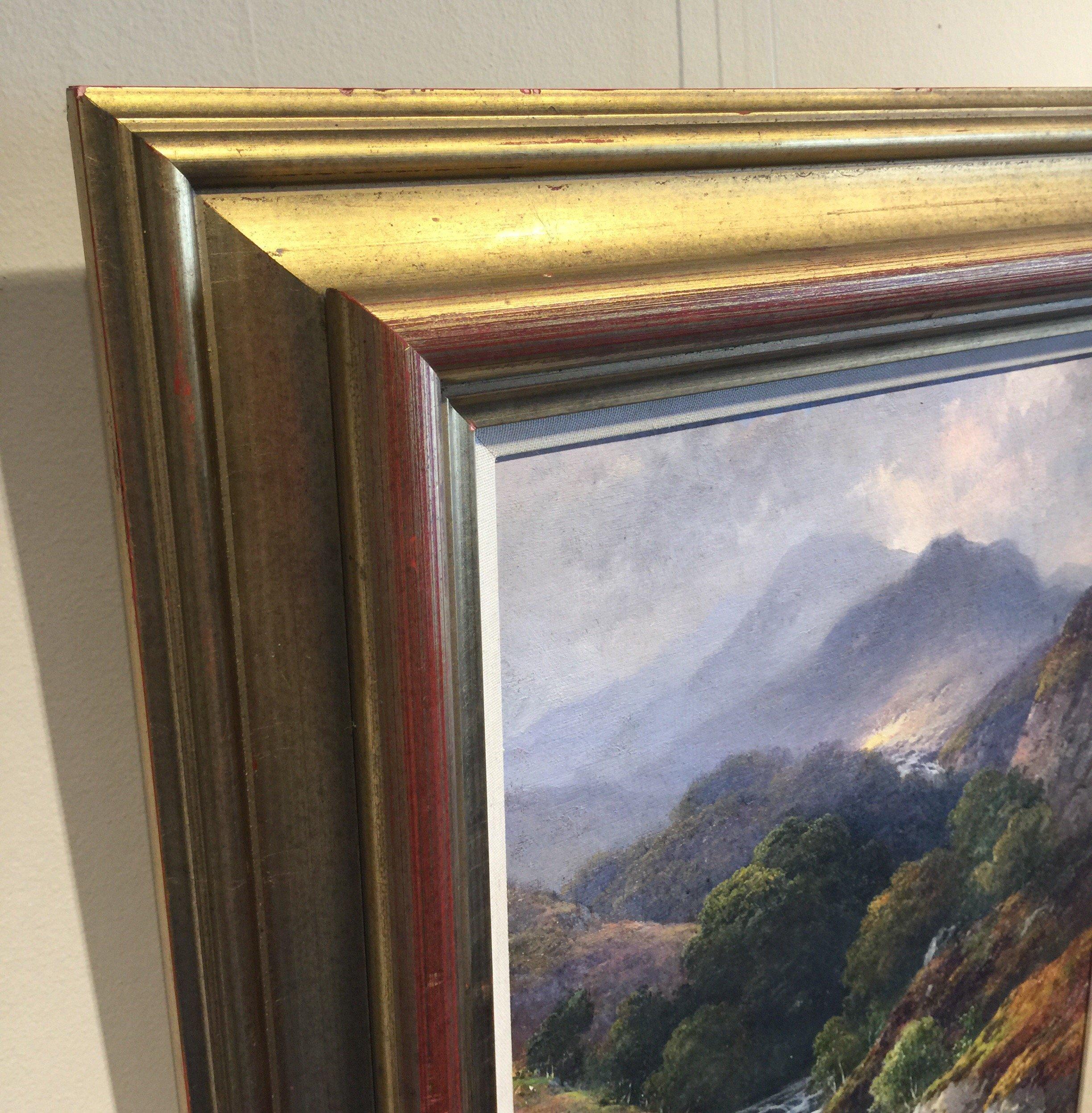 An attractive framed oil on canvas painting by Thomas J Banks. A nicely executed atmospheric highland scene signed and dated lower right '86. The scene with cloud shrouded mountains in the distance and a waterfull flowing through the wooded trees