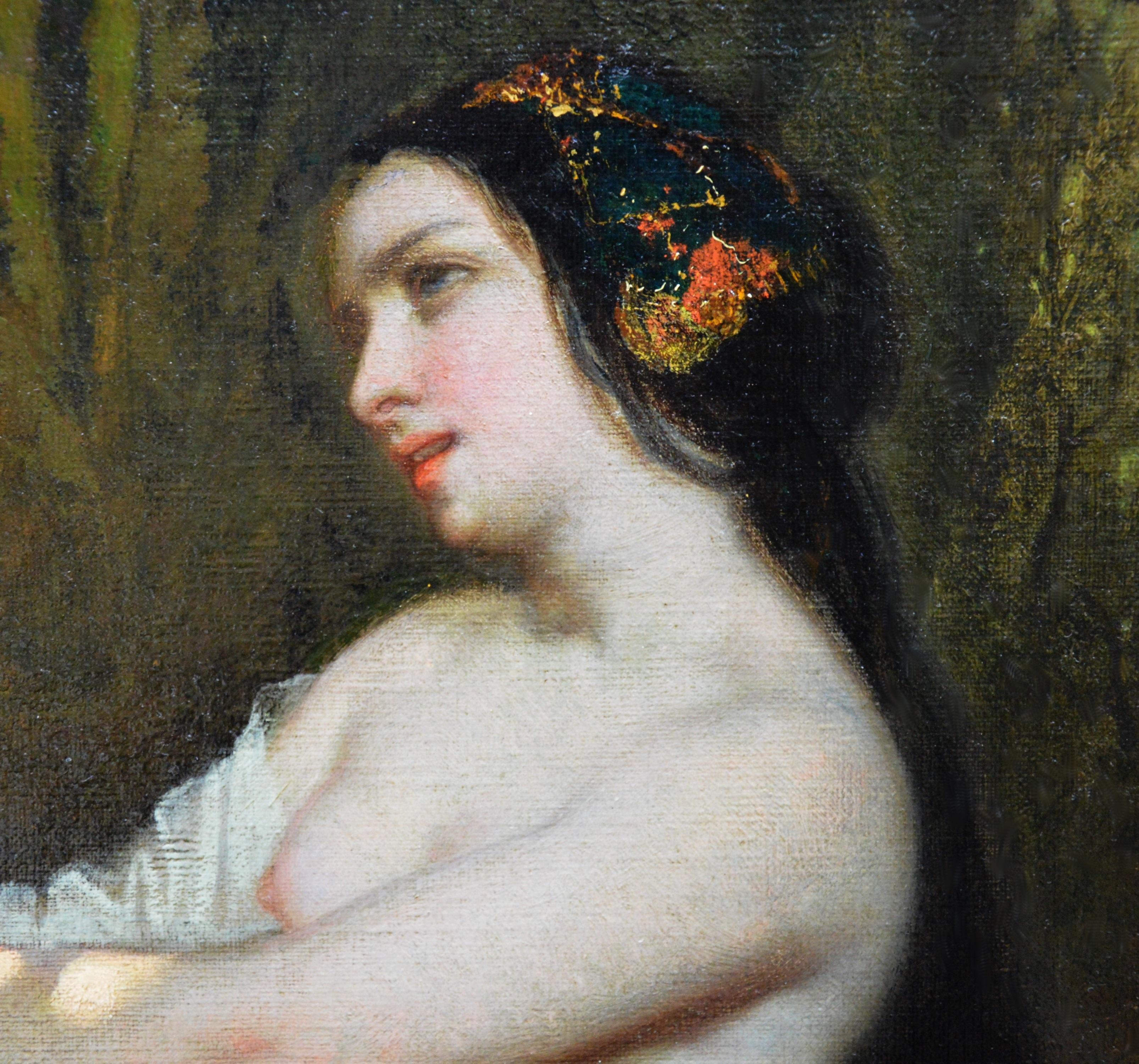 This is a large fine mid-19th century oil on canvas depicting a semi-naked girl beside a woodland stream with a group of shocked onlookers in the background by the eminent French Romantic painter Auguste-Barthélemy Glaize 1807–1893. ‘Femme-au-Bain’
