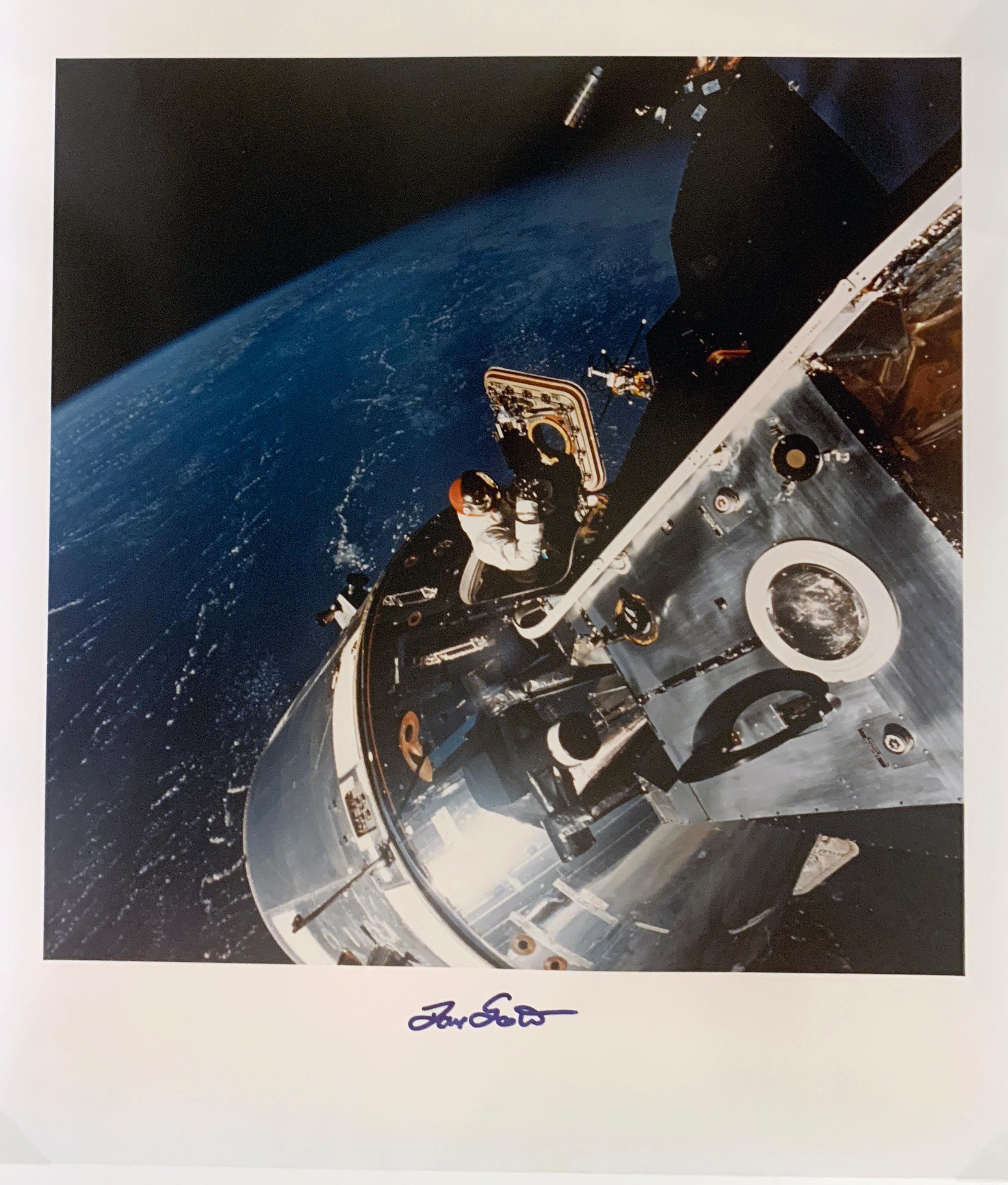 Seen from the docked Lunar Module Spider, astronaut David Scott stands in an open hatch of the command module Gumdrop in space. The third mission in NASA’s Apollo program, Apollo 9 was launched on 3rd March 1969, carrying American astronauts James