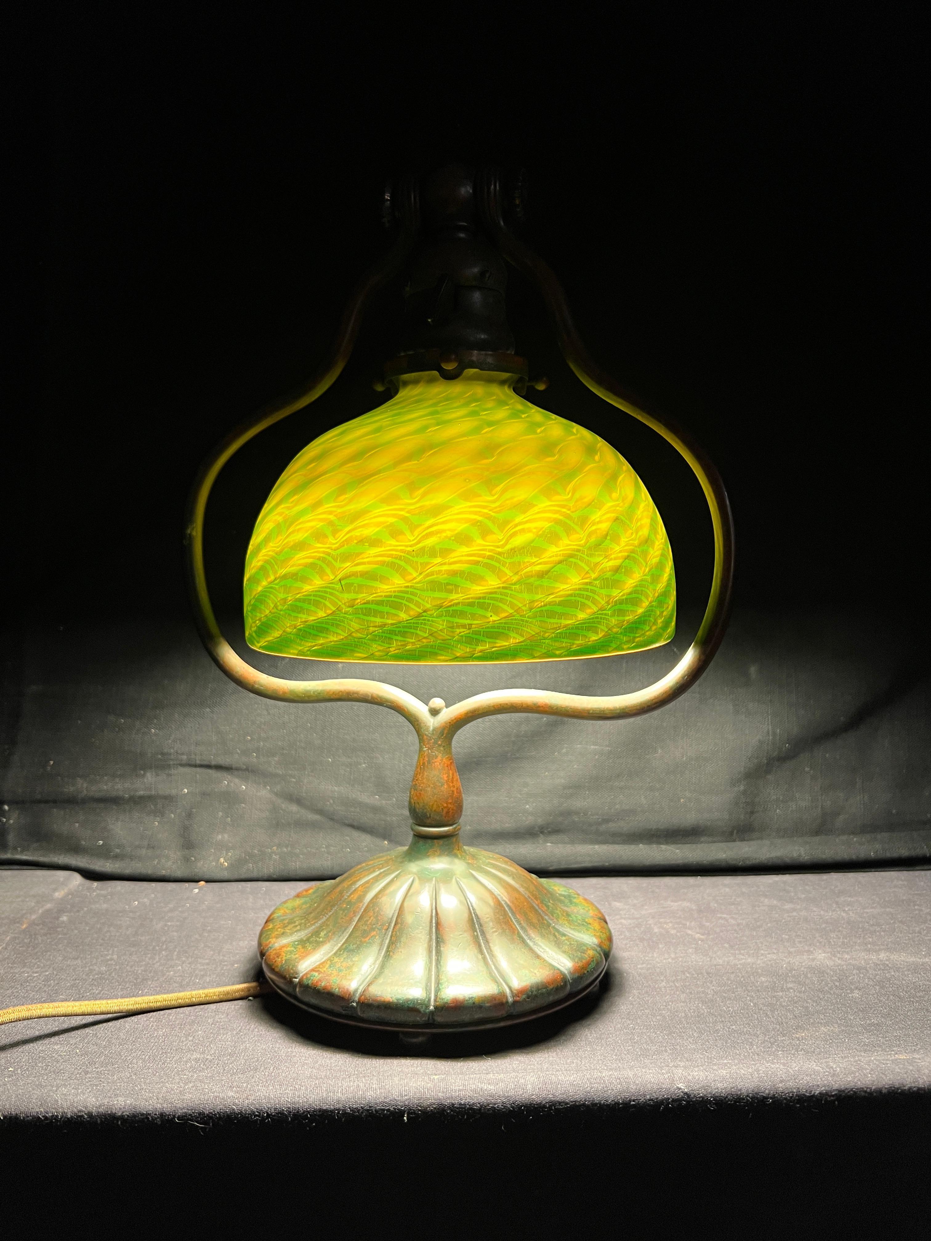 Favrile Damascene Harp Desk Lamp, c. 1910
Tiffany Studios
Patinated Bronze and Favrile Glass
Impressed to Base 