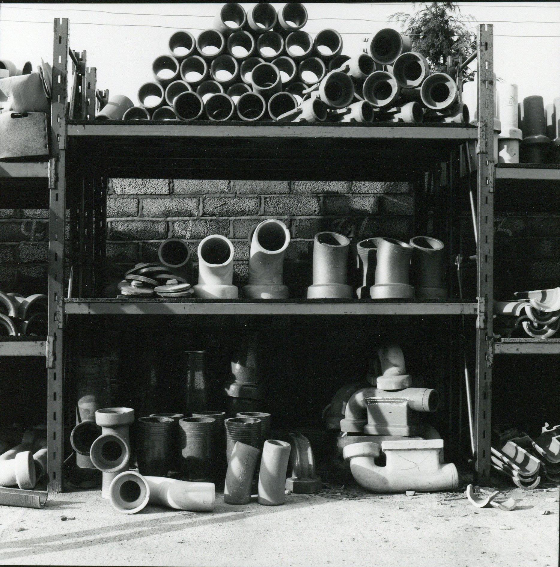 Rosemary Ellis (1910-1988)
Pipes V
Original photography for Pipes and Wires in the Outlooks and Insights series published by Bodley Head, composed by Rosemary & Charlotte Ellis.
Gelatin Silver Print
13x13cm

Rosemary Ellis was well known as a