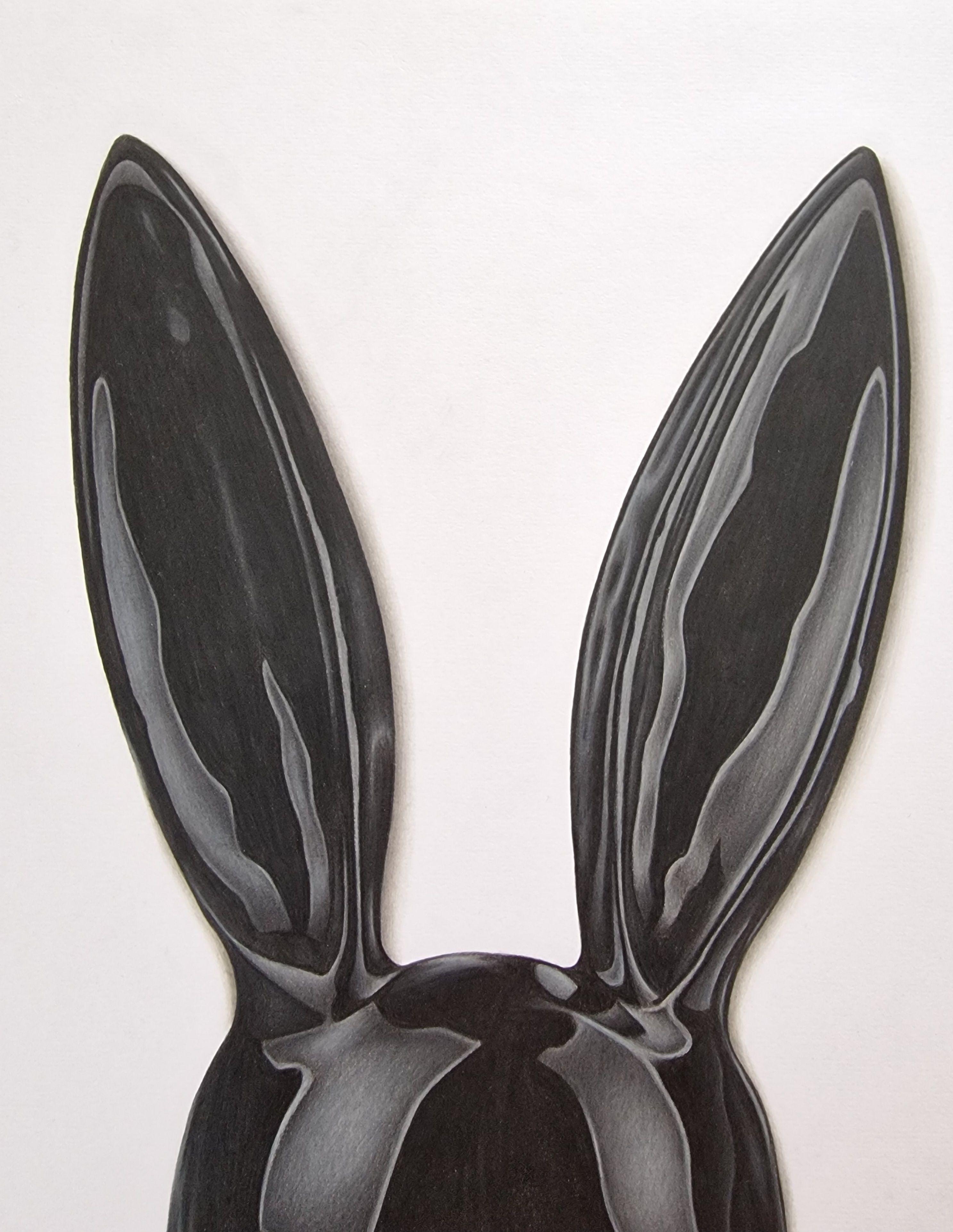 This realist colour pencil drawing of a bunny mask creates a contemporary minimal artwork that pops forward from the paper making you the viewer feel as though you could reach forward and pick it up.    The tactile nature of the work capturing the