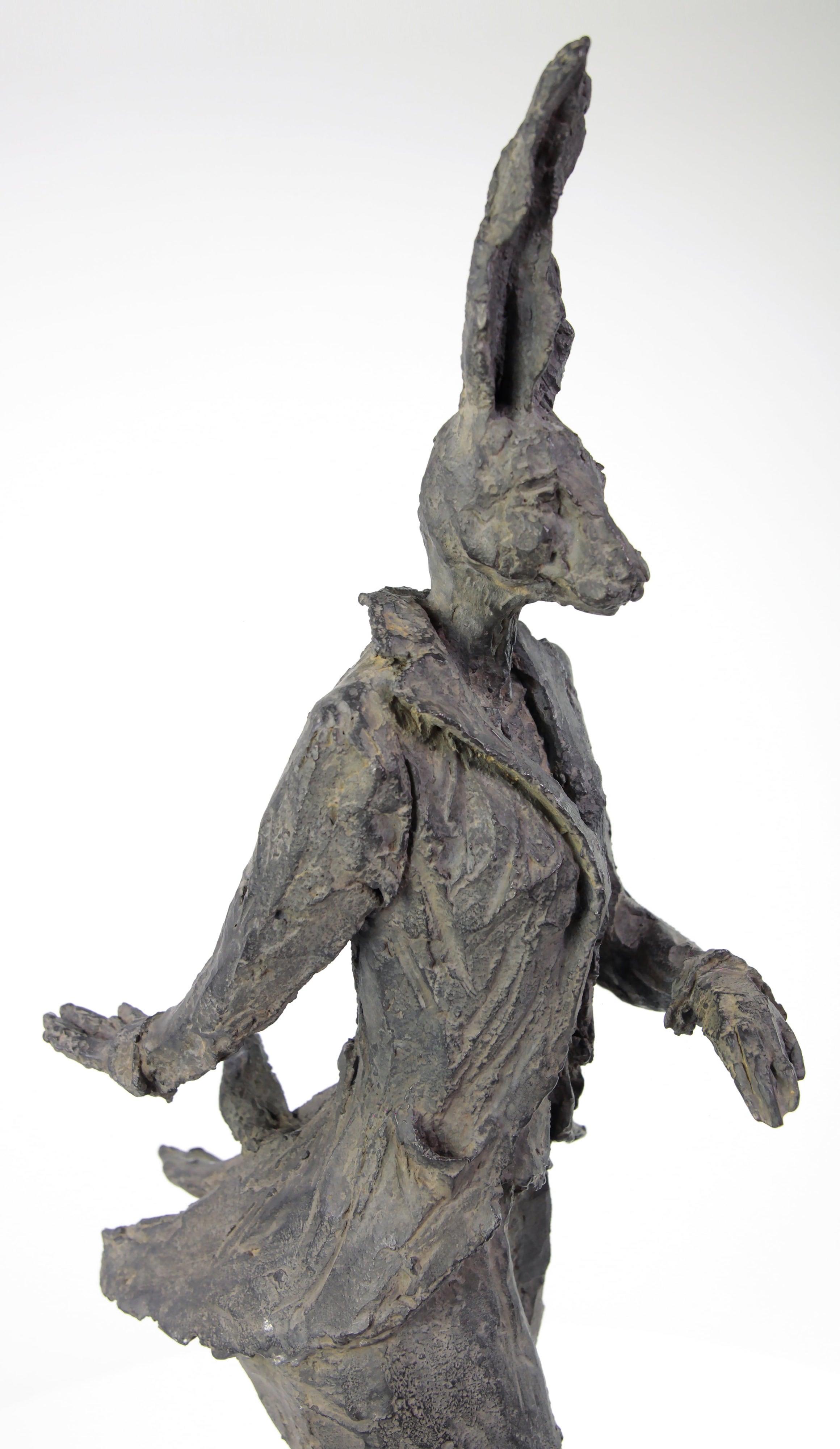 Walking Hare (Hase qui marche) is a bronze sculpture by French contemporary artist Cécile Raynal.
75 cm × 37 cm × 20 cm. Limited edition of 8 casts + 4 artist's proofs.
This bronze piece represents a standing female hare, wearing a basque jacket and