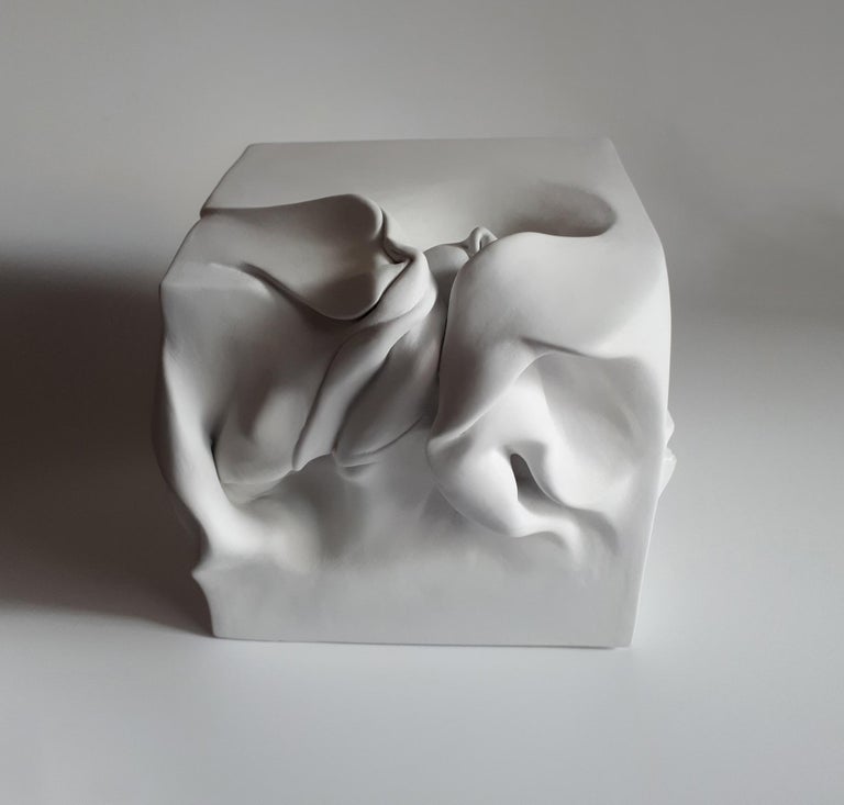Cube 1 by Sharon Brill.  
Painted clay sculpture, 19 cm × 20 cm × 21 cm.
Ceramic artist Sharon Brill creates abstract and curved sculptures with an almost organic appearance. The water world is what inspires her: she drives her inspiration from the