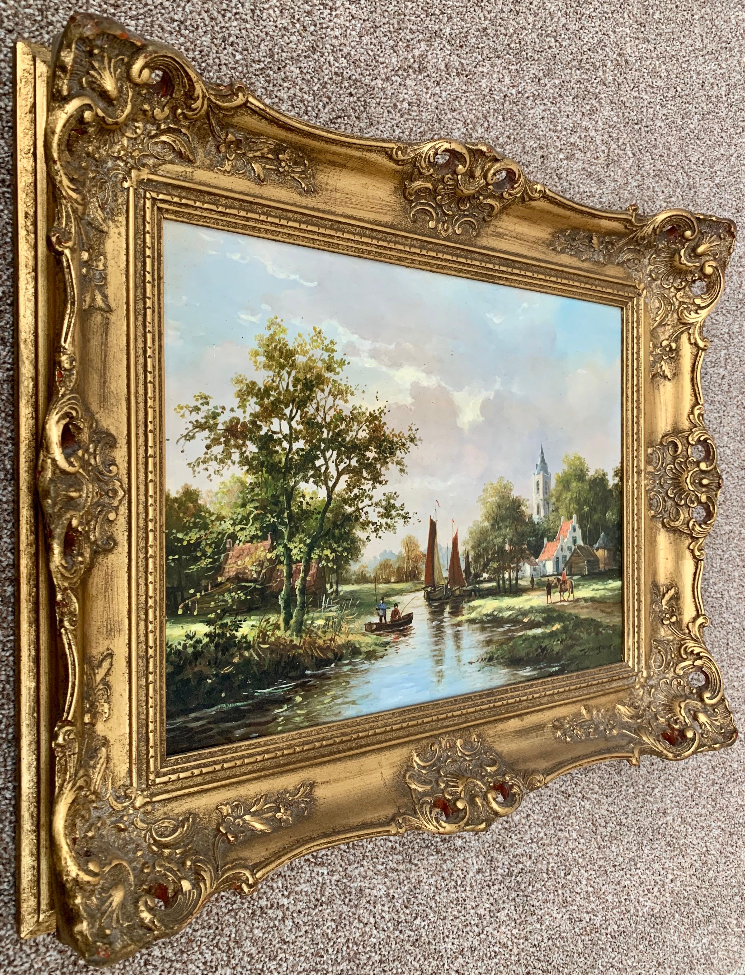 Classical Traditional 20th Century River Landscape Oil Painting by Dutch Painter. A village scene with church, horses, trees, figures and boats against the background of a beautiful summer sky.

Art measures 15.5 x 11.5 inches
Frame measures 21.5 x