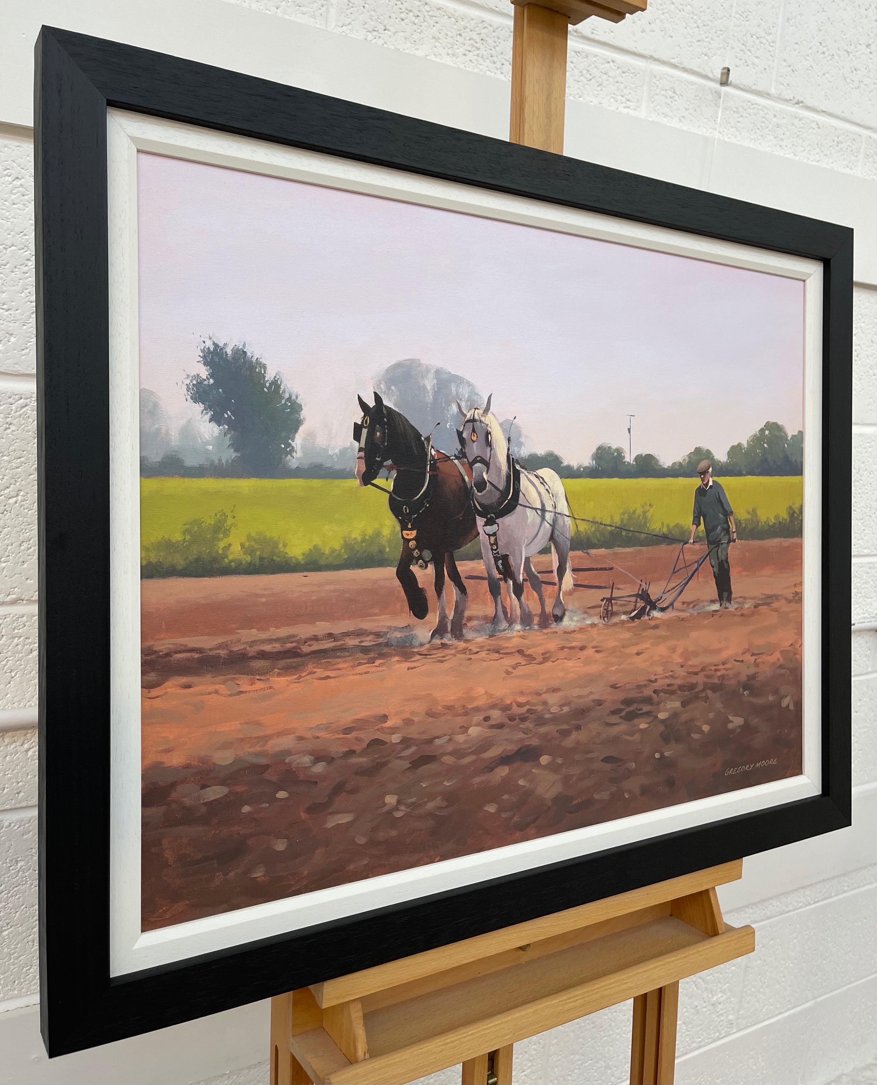 Caballos con granjero y arado en el campo de Irlanda por un artista irlandés contemporáneo - Painting de Gregory Moore