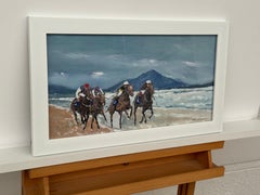 Horse Racing on Tramore Beach in Southern Ireland with Mountains in the Distance