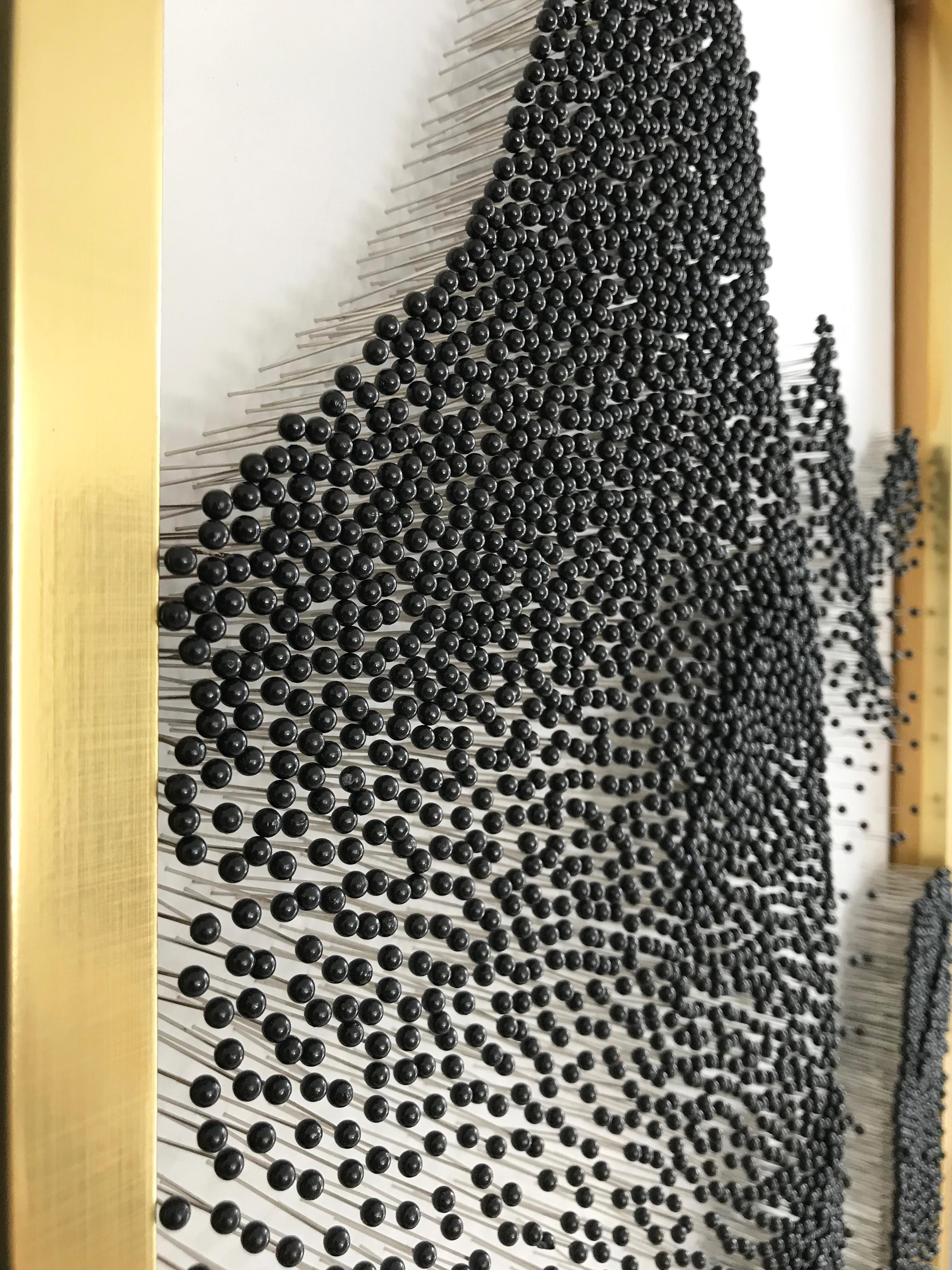 This beautiful abstract sculpture on framed canvass has a 3D impact, for the pins on it give it visual movement and perspective. It is an elegant piece perfect for decorating spaces delicately. It is not heavy at all and is easy to install,  (metal