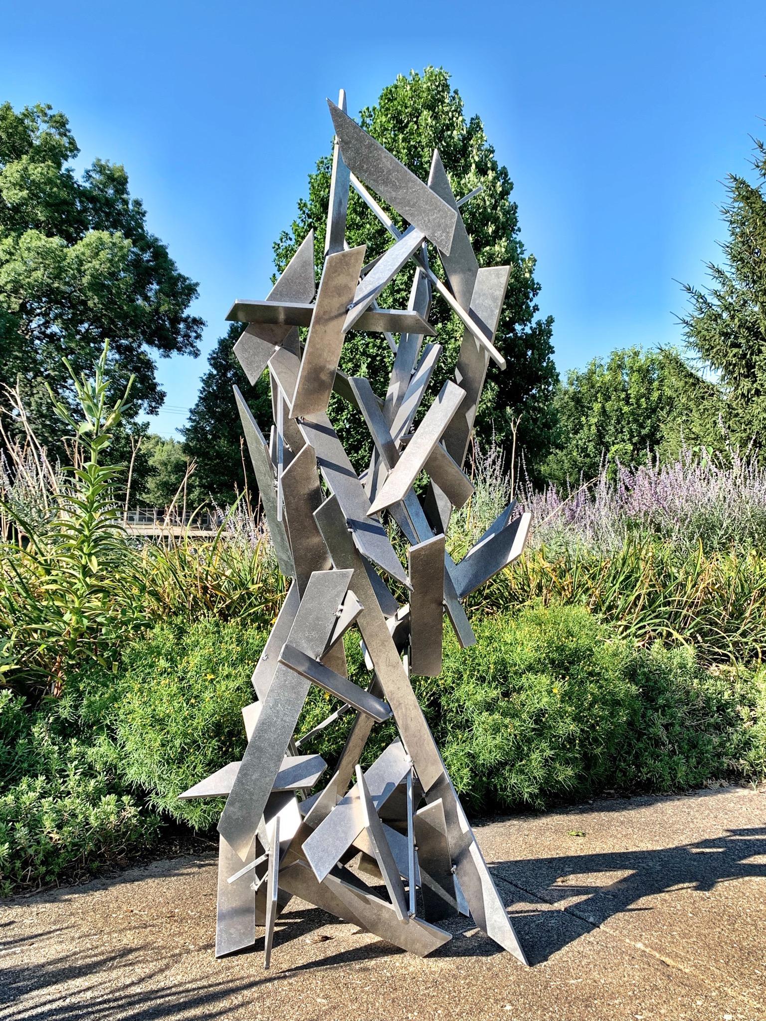 TITLE: Hysteria 
ARTIST: Sebastian R.

DIMENSIONS
H 66 in. x W 24 in. x D 24 in.
H 167.64 cm x W 60.96 cm x D 60.96 cm

DESCRIPTION:
Hysteria is a welded metal sculpture made from abrasively tumbled pieces of thick aerospace grade aluminum. This