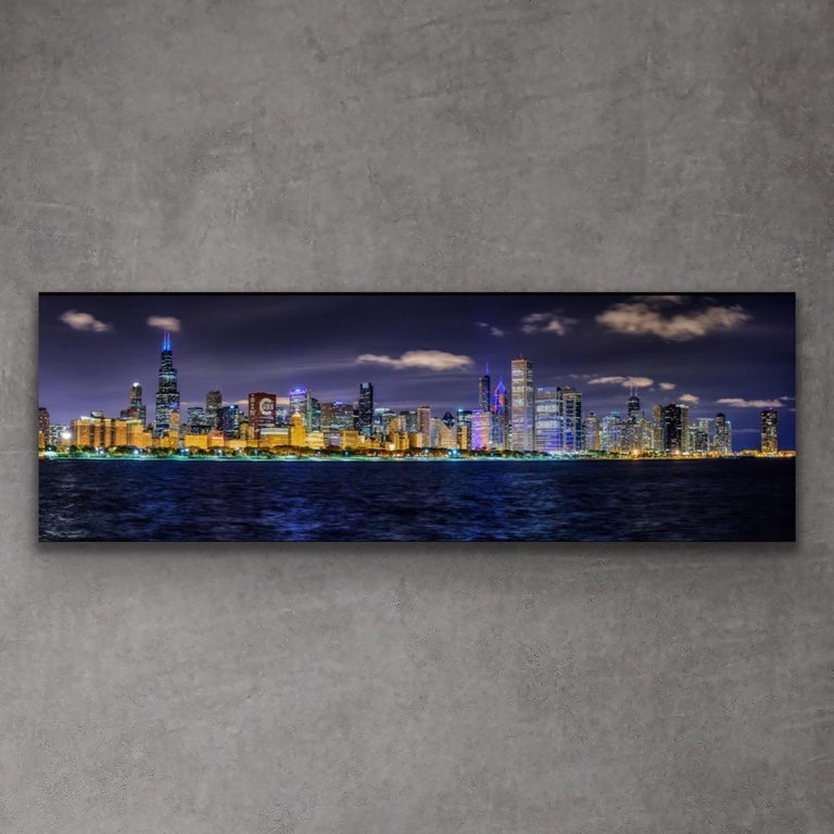 This stunning panoramic photograph of Chicago's skyline is printed on a lightweight metal composite and comes ready to hang. This vibrant composition can be hung both indoor and outdoor as it is weather resistant.

-Artist: Scott F.
LIMITED EDITION;