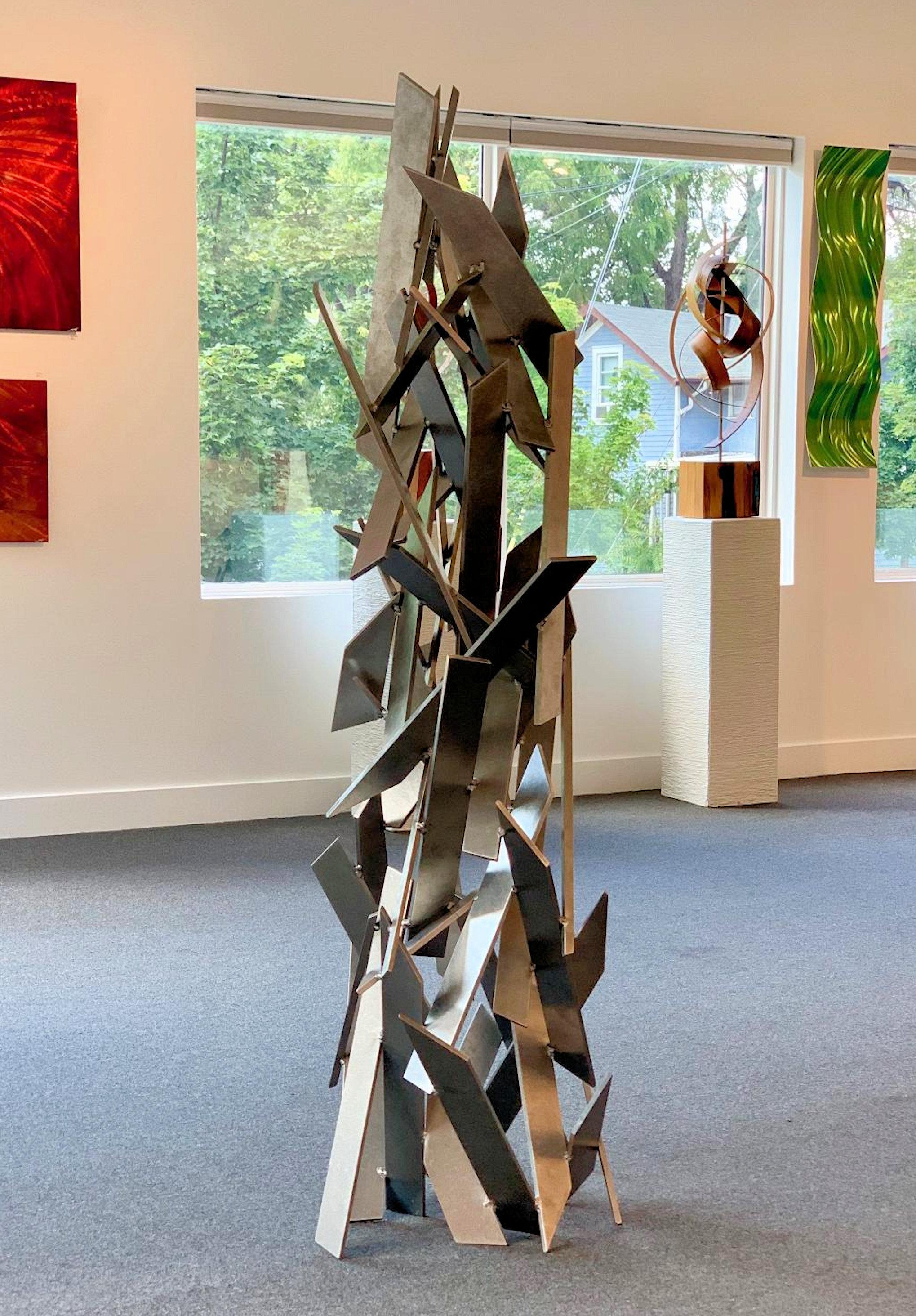 TITLE: Mania
ARTIST: Sebastian R.

DIMENSIONS
H 72 in. x W 27 in. x D 24 in.

DESCRIPTION:
Mania is an original hand-crafted and hand-welded metal sculpture made from abrasively tumbled pieces of thick aerospace grade aluminum. This sculpture