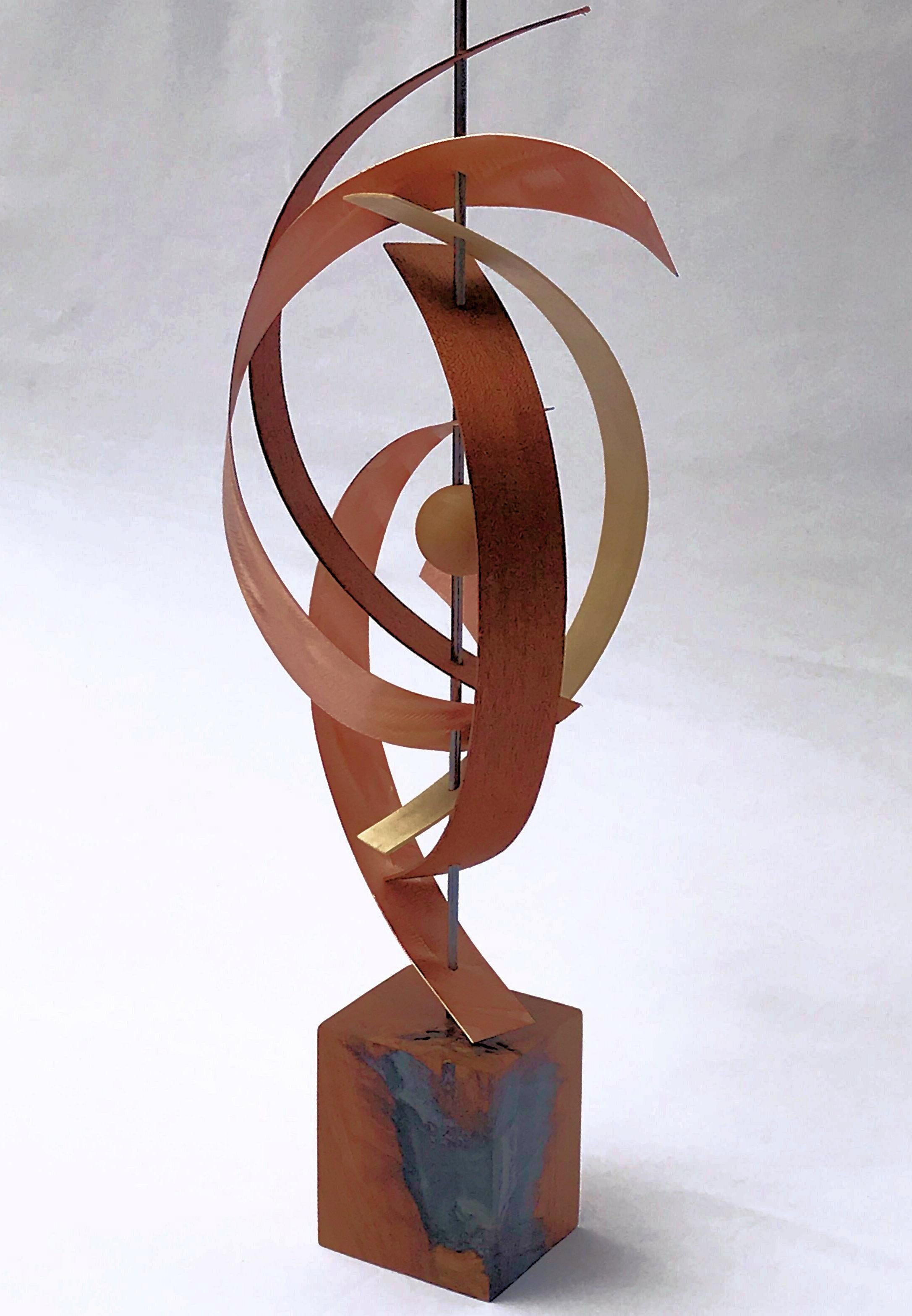 Title: Woven
Description: Black walnut, hickory and mahogany bent into place with bent copper whirling throughout, holding in place a wooden sphere.  

About the Artist:
Jeff Linenkugel was born and raised in Toledo Ohio and is a graduate of Ohio