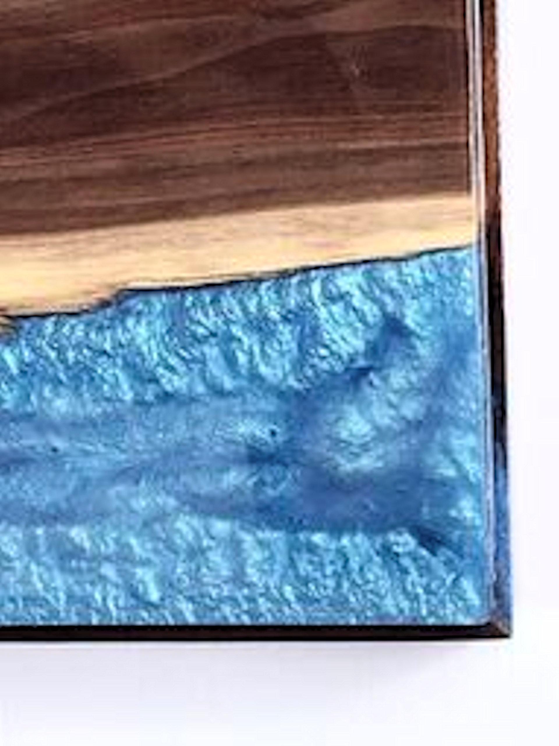 Title: Lightning
Description: Black walnut mixed with blue epoxy inlay. When back-lit, epoxy comes alive and resembles lightning. This piece hangs horizontally or vertically.

About the Artist:
Jeff Linenkugel was born and raised in Toledo Ohio and