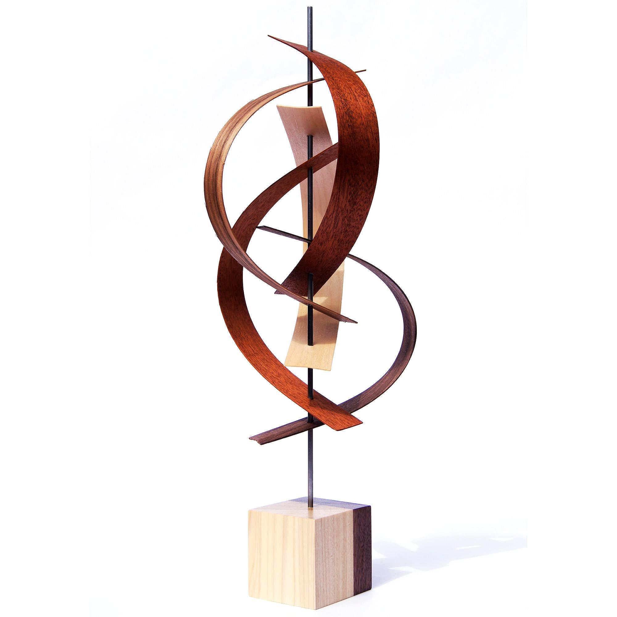 Description:  This sculpture consists of formed black walnut, maple, and mahogany wood slats. The base is 3x3x3" solid wood, walnut and poplar. This sculpture is an open-edition multiple original; hand-made by the artist.
Title: Sails

Artist