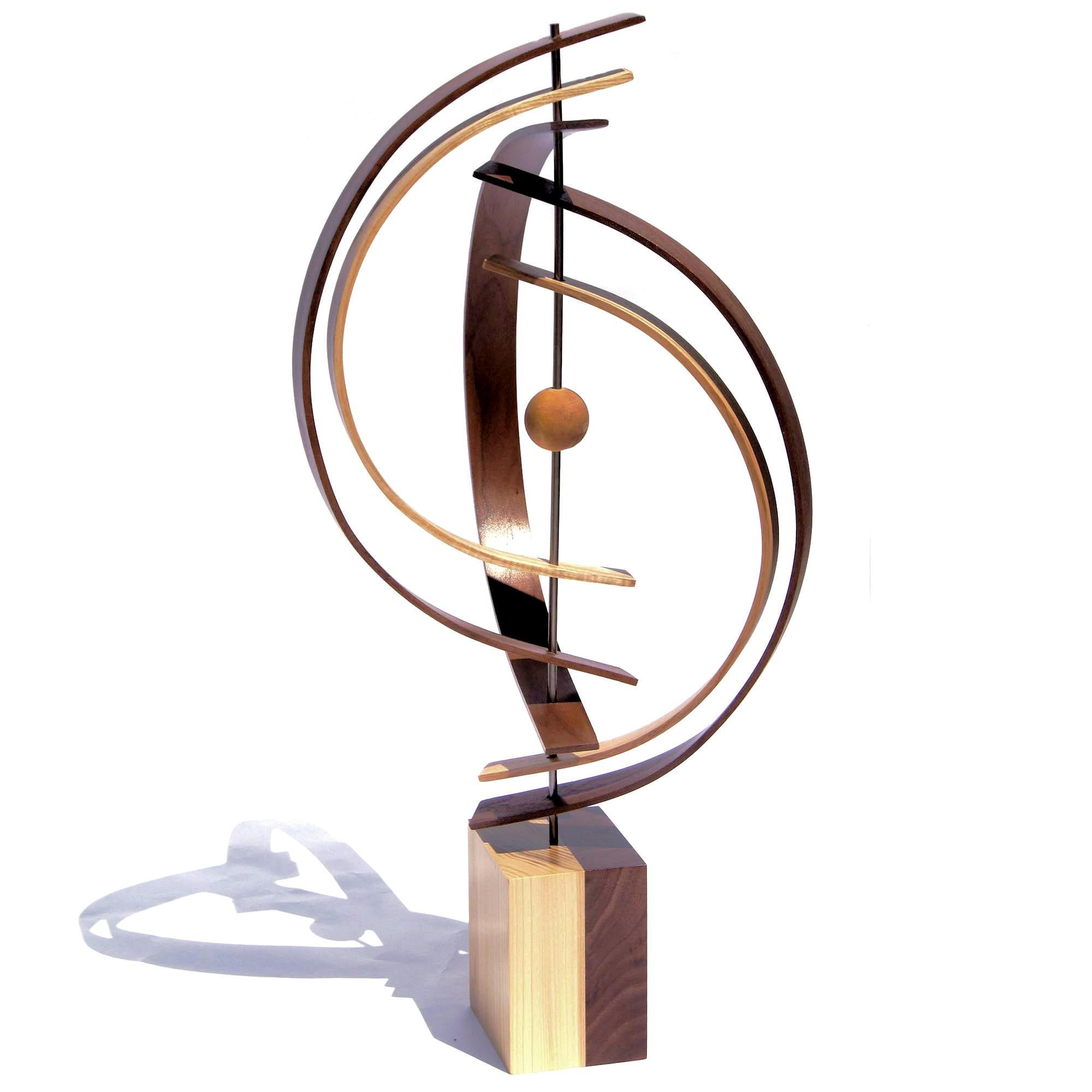 Description:  This sculpture consists of formed black walnut, ash, cherry wood slats, and wood sphere. The base is 5