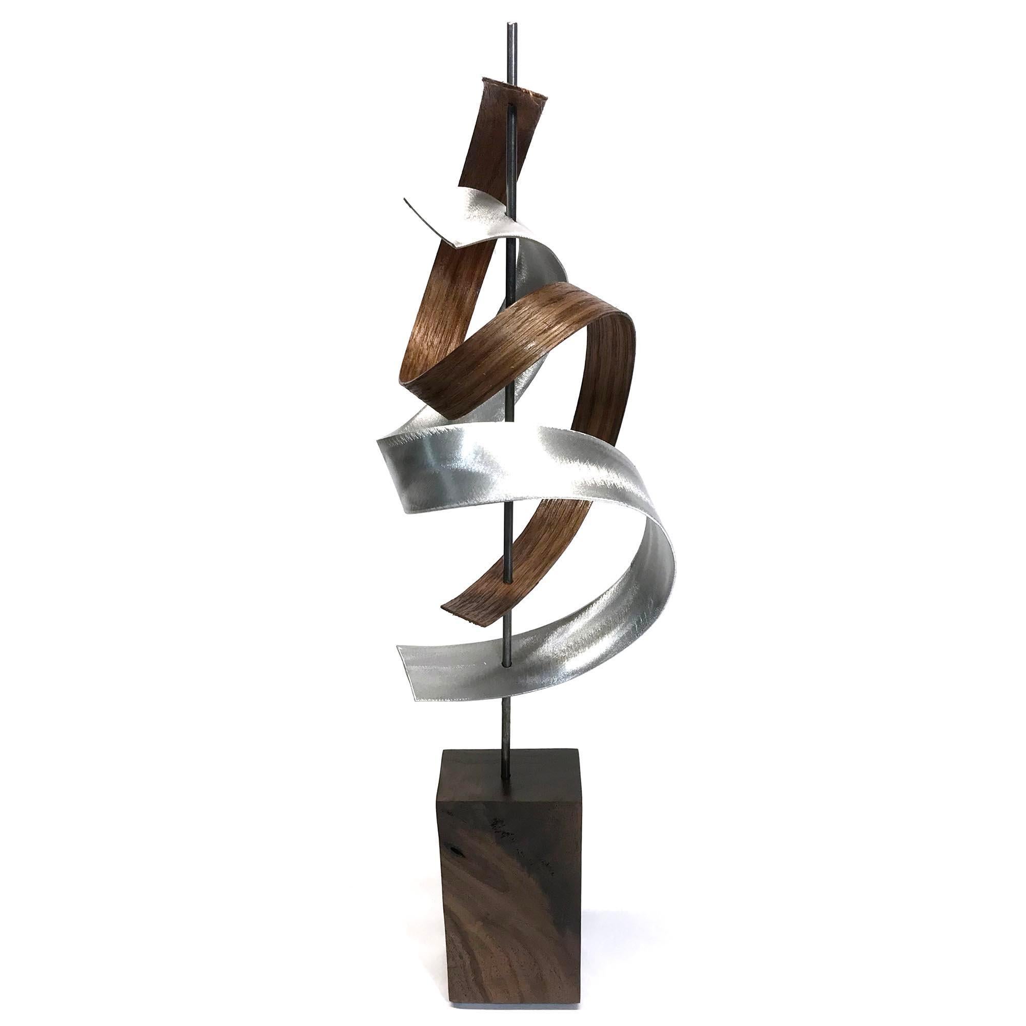 Description:  This sculpture consists of formed walnut, ash, aluminum slat with custom grind. This sculpture is an open-edition multiple original; hand-made by the artist.
Title: The Climb

Artist Bio:
Jeff was born and raised in Toledo Ohio and is