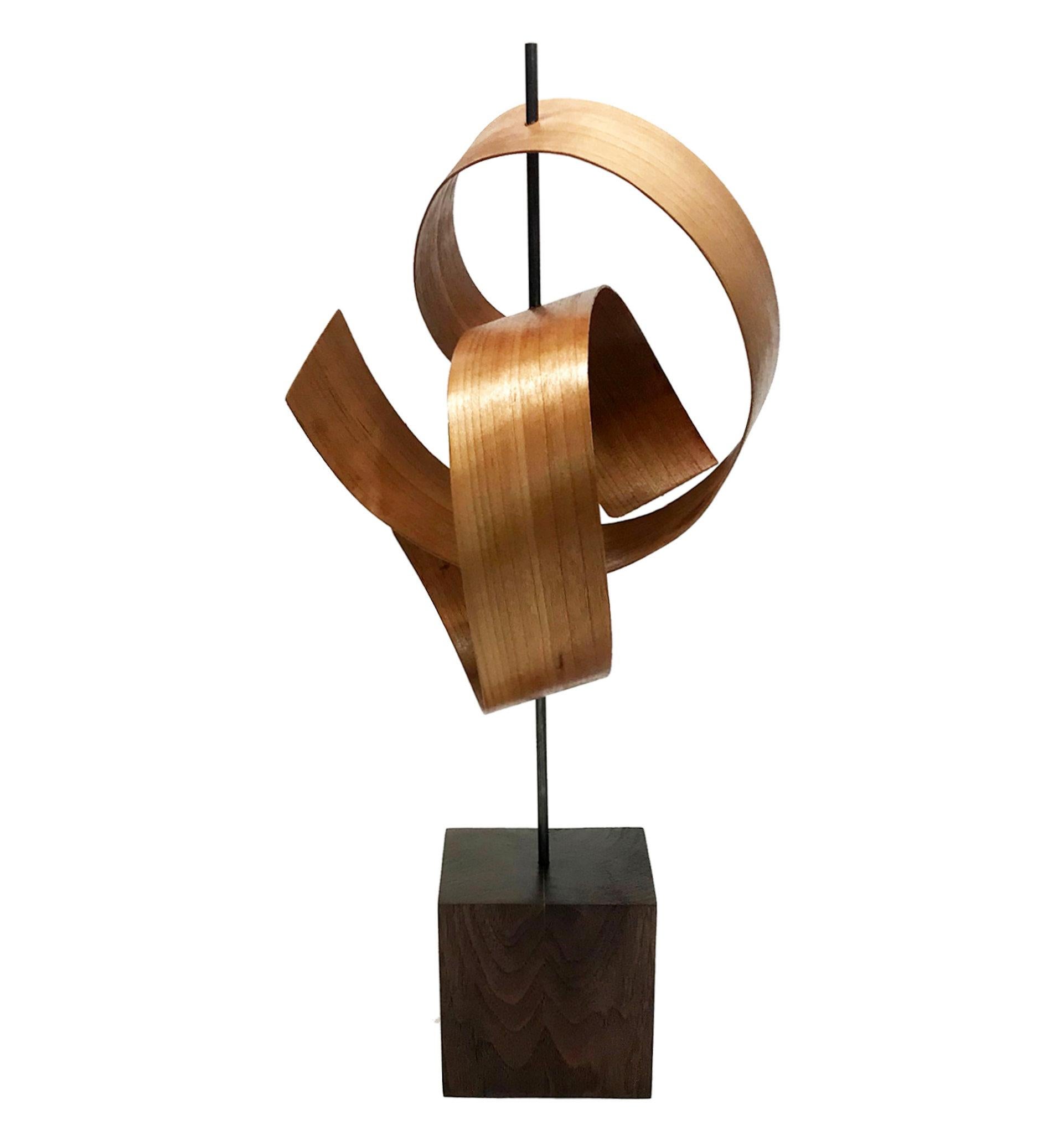 Description:  This sculpture consists of bent 1/8x2" mahogany on a black walnut base. This sculpture is an open-edition multiple original; hand-made by the artist.
Title: Ripcurl

Artist Bio:
Jeff was born and raised in Toledo Ohio and is a graduate