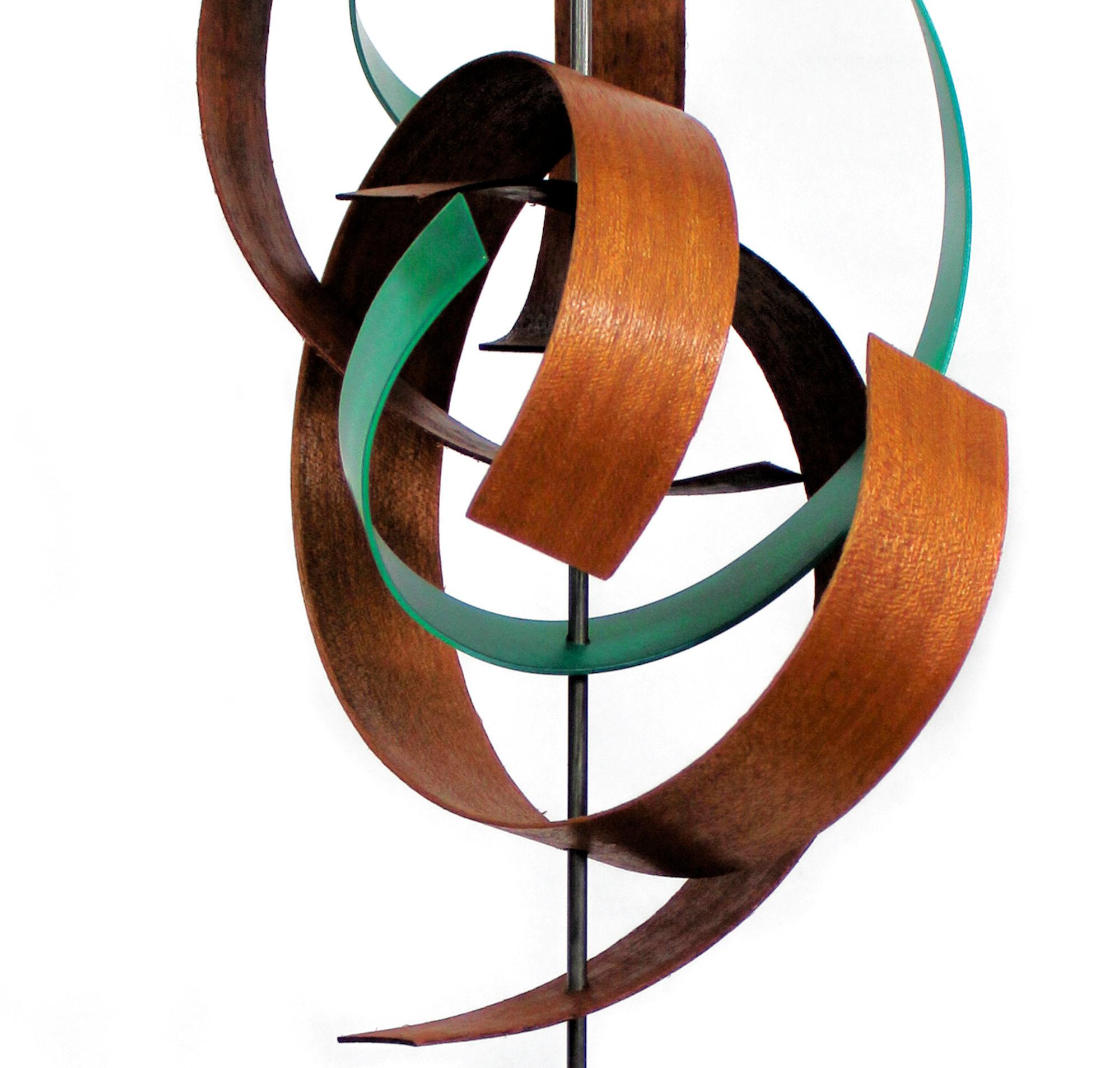 Description:  This sculpture consists of pre-formed black walnut, mahogany, and tinted aluminum. Solid cherry base. This sculpture is an open-edition multiple original; hand-made by the artist.
Title: Intertwine

Artist Bio:
Jeff was born and raised
