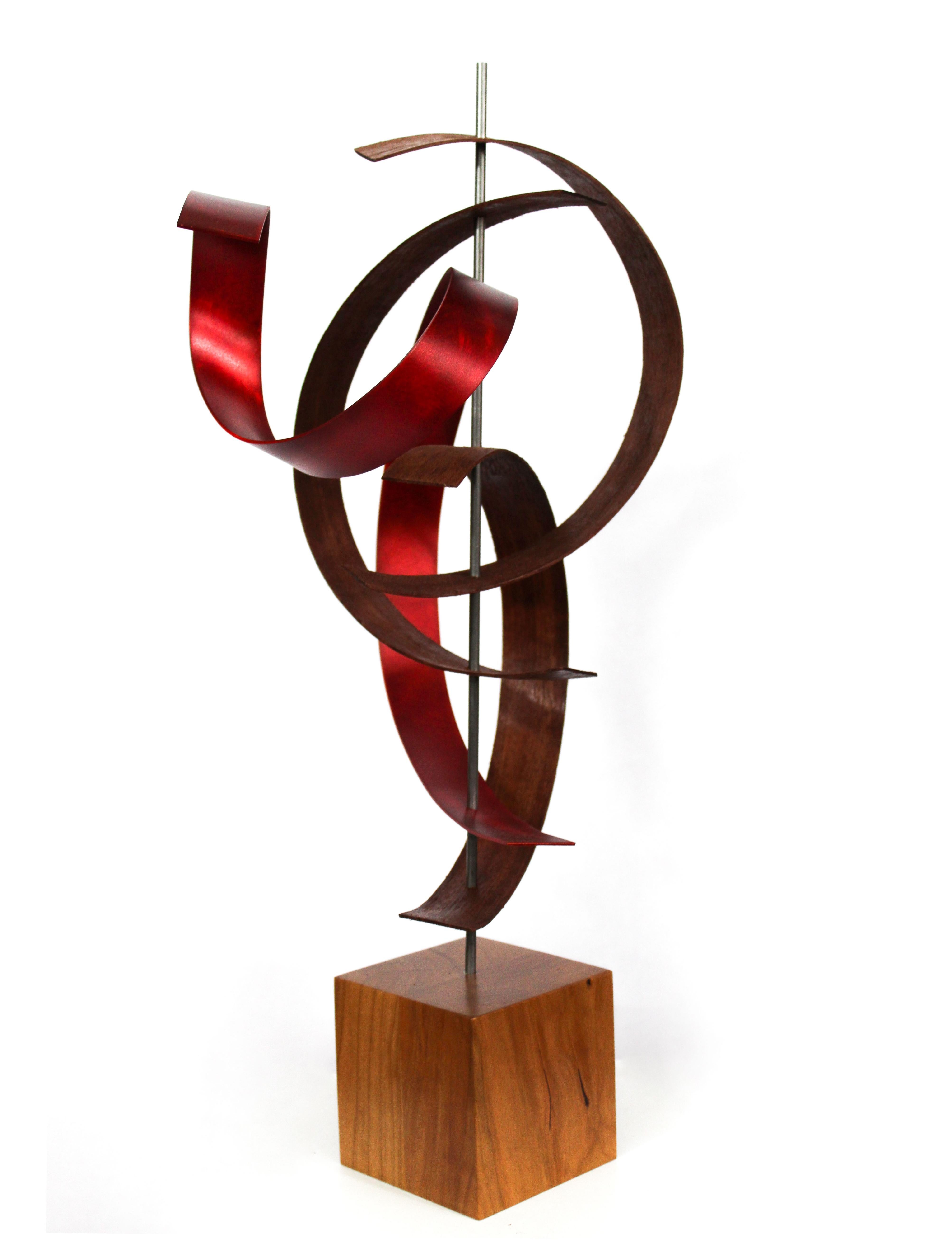 Description:  This sculpture consists of pre-formed black walnut, mahogany with tinted aluminum and grind pattern. Solid cherry base. This sculpture is an open-edition multiple original; hand-made by the artist.
Title: Wind

Artist Bio:
Jeff was