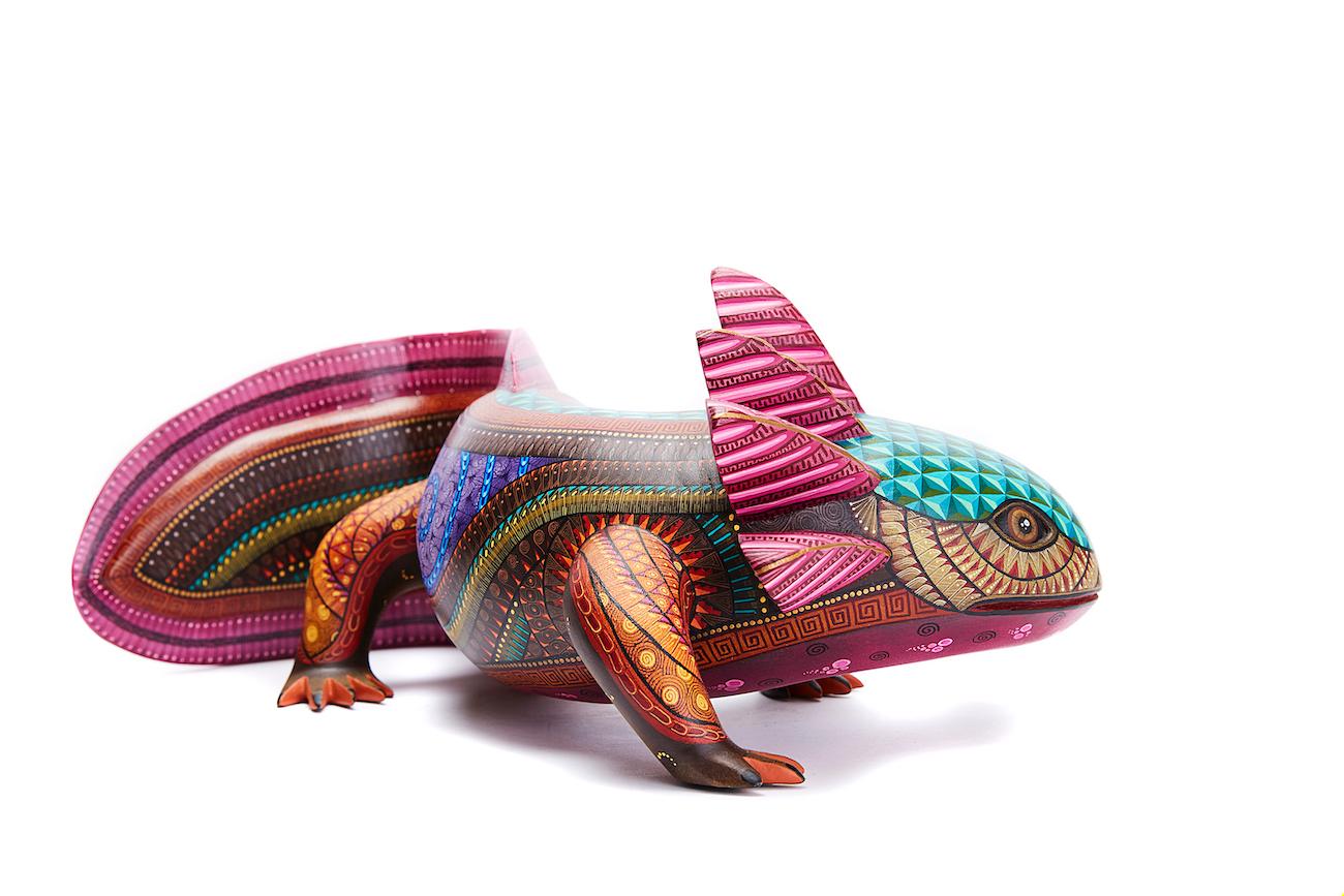 Iguana Amigable - Friendly Iguana
This Mexican Wood Iguana was made with Copal wood, wood carving technique gouges, machete and sandpaper, decorated with natural dyes and acrylic paintings with Zapotec symbols.
At Cactus Fine Art, we offer an