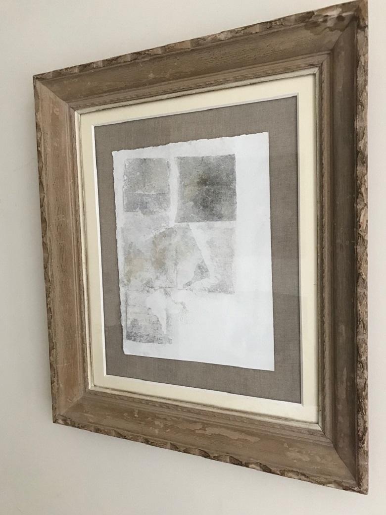 A monochrome mixed media collage dated 1979. Indistinctly signed. Mounted on a linen back and underglaze. Framed in a stripped pine French carved 1960's frame.