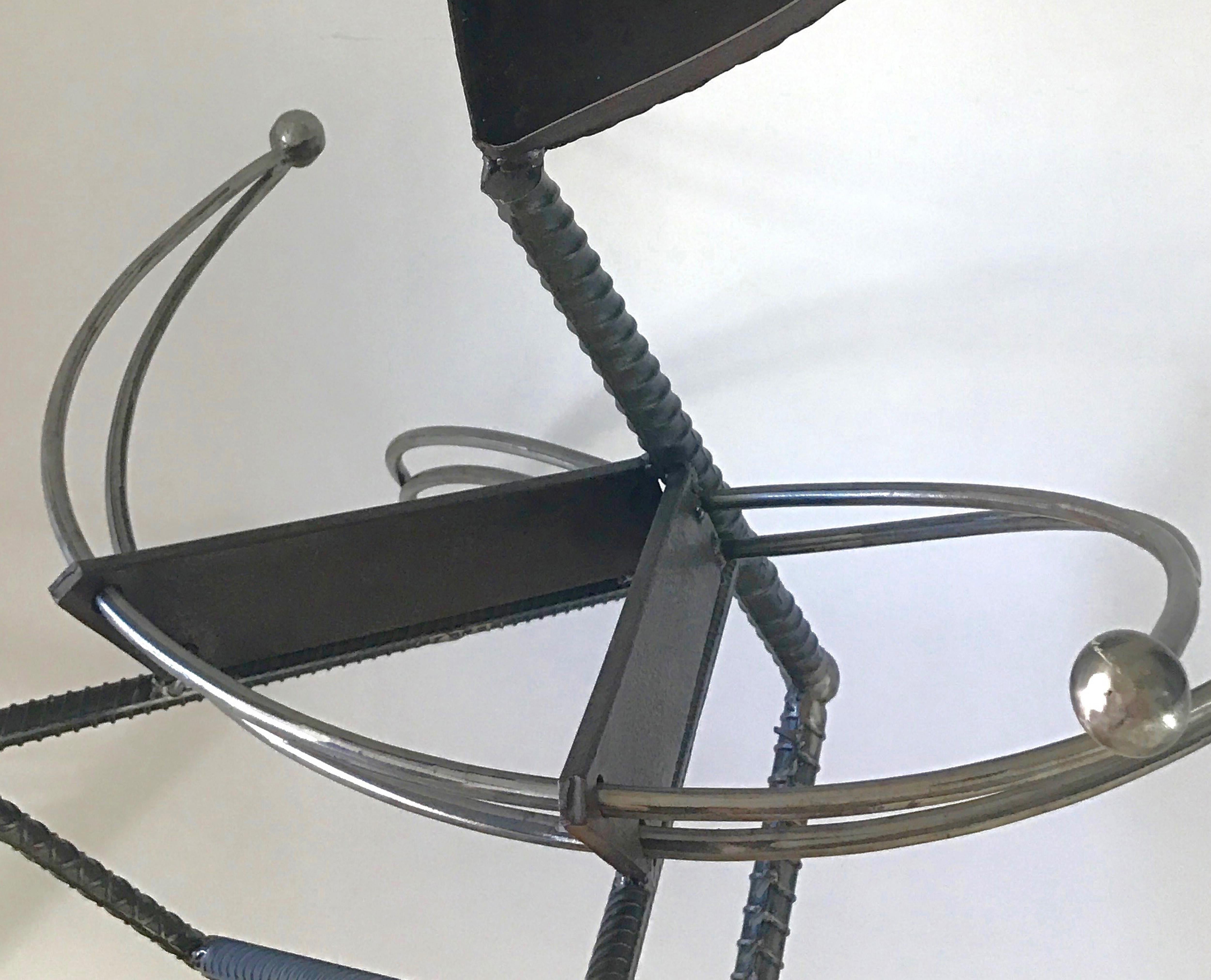Janet Rutkowski Abstract Sculpture - "Peligroso" swooping arms spiral a welded steel spine with daring attitude