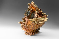 "Sea Form 4", textured ceramic in golds and browns, embodies essential clay