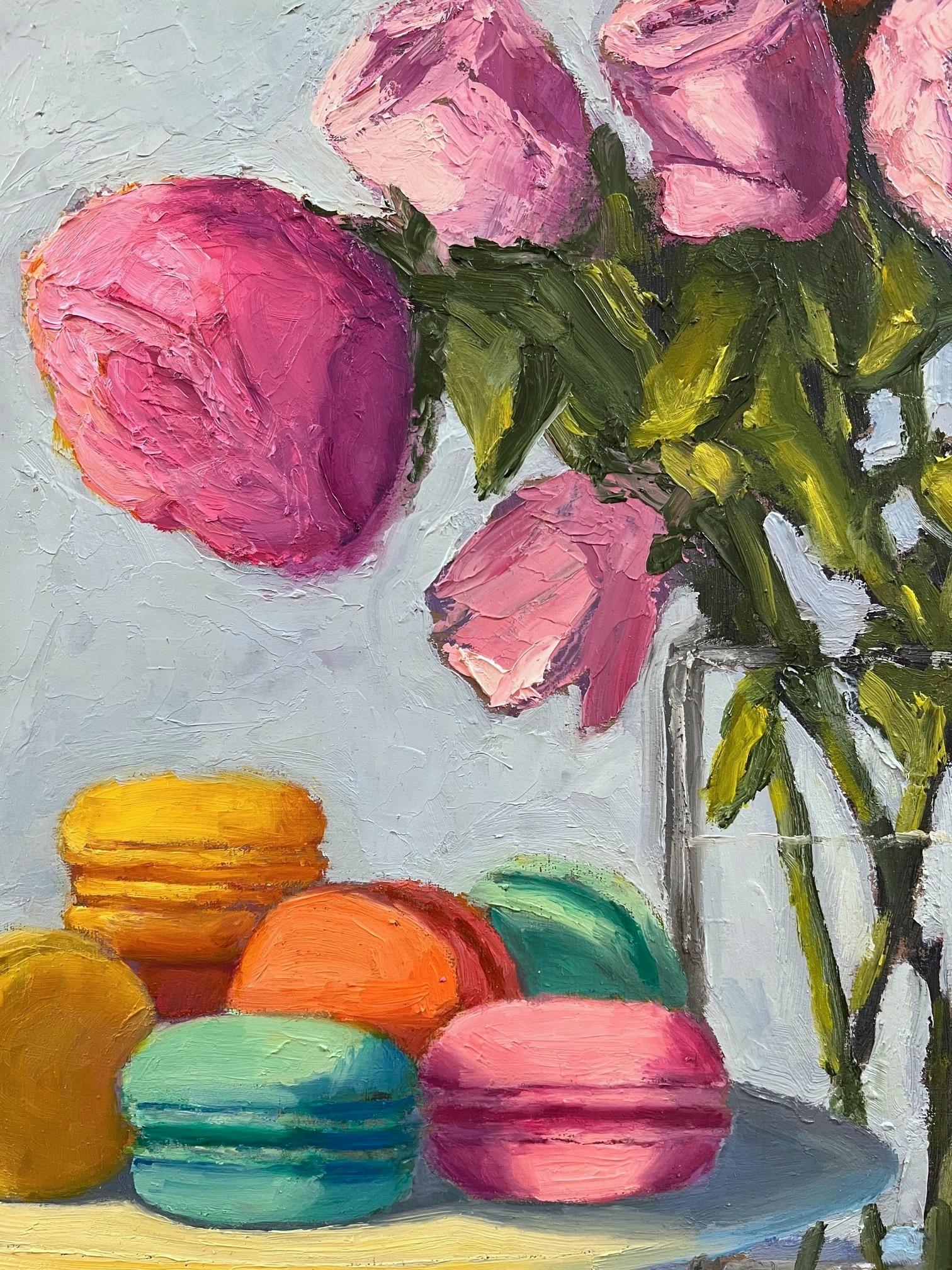 <p>Artist Comments<br />Artist Pat Doherty displays colorful macarons on a pedestal plate next to an arrangement of pink and orange roses. A dainty blue striped tablecloth covers the table it lays on. Her delectable still-life painting draws on her