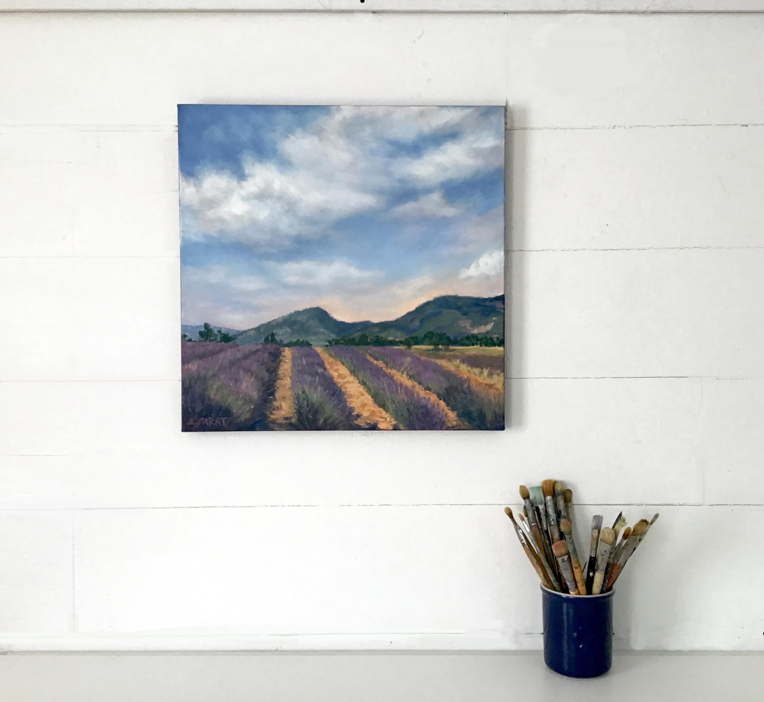 <p>Artist Comments<br>Artist Elizabeth Garat presents an impressionist landscape of lavender fields. The piece recalls a warm day in July during the height of summer. Billowy clouds in pink and blue hues stretch the horizon in a beautiful display of