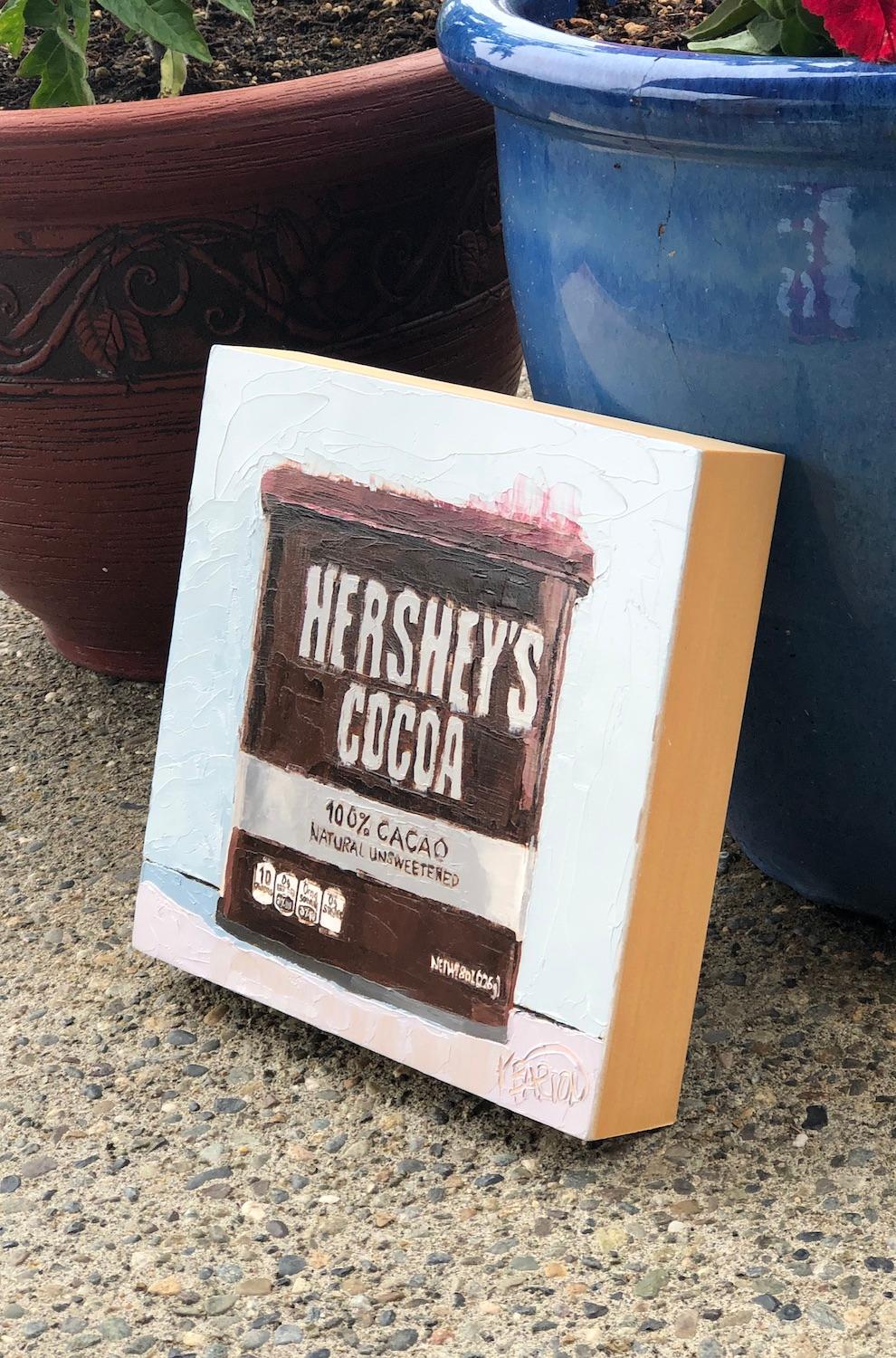 <p>Artist Comments<br>Artist Karen Barton presents a still life of Hershey's cocoa, classic food to be found in a kitchen. 