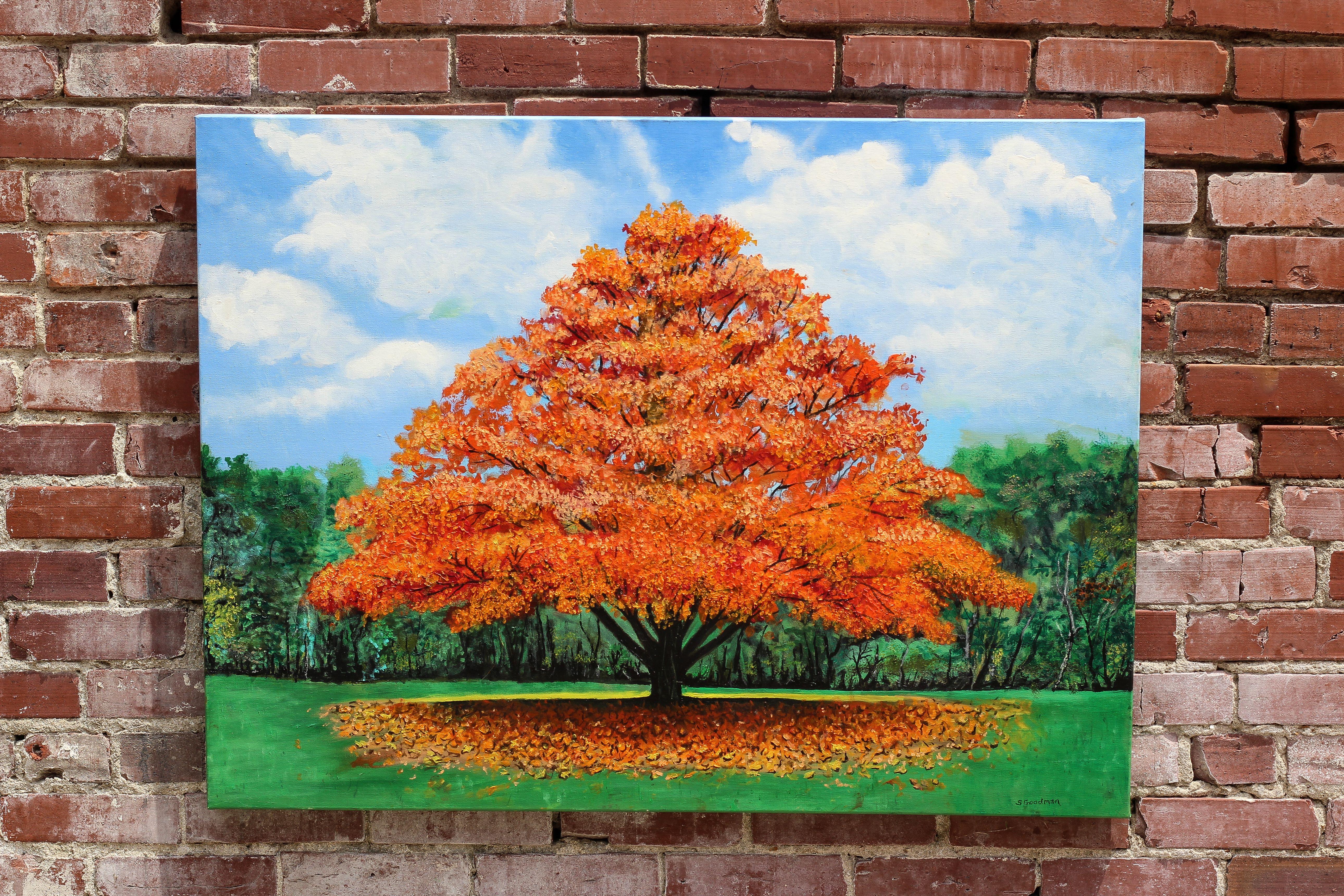 <p>Artist Comments<br>Artist Shela Goodman pictures an autumnal tree standing prominently from the green forest behind. Fiery orange leaves abundantly adorn the branches before they fall to the ground. Shela creates a striking view of the distinct