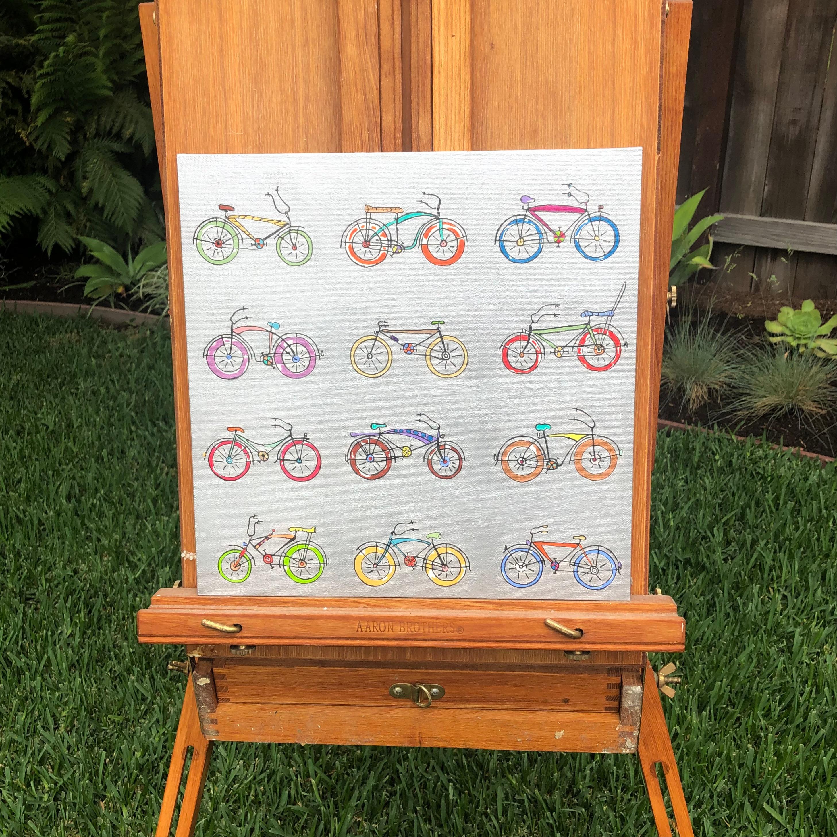 <p>Kommentare des Künstlers<br>Der Künstler John McCabe stellt zwölf bunte Fahrräder in einem Raster dar. Der solide silberne Hintergrund lässt die Fahrräder in leuchtenden Farben erstrahlen. 