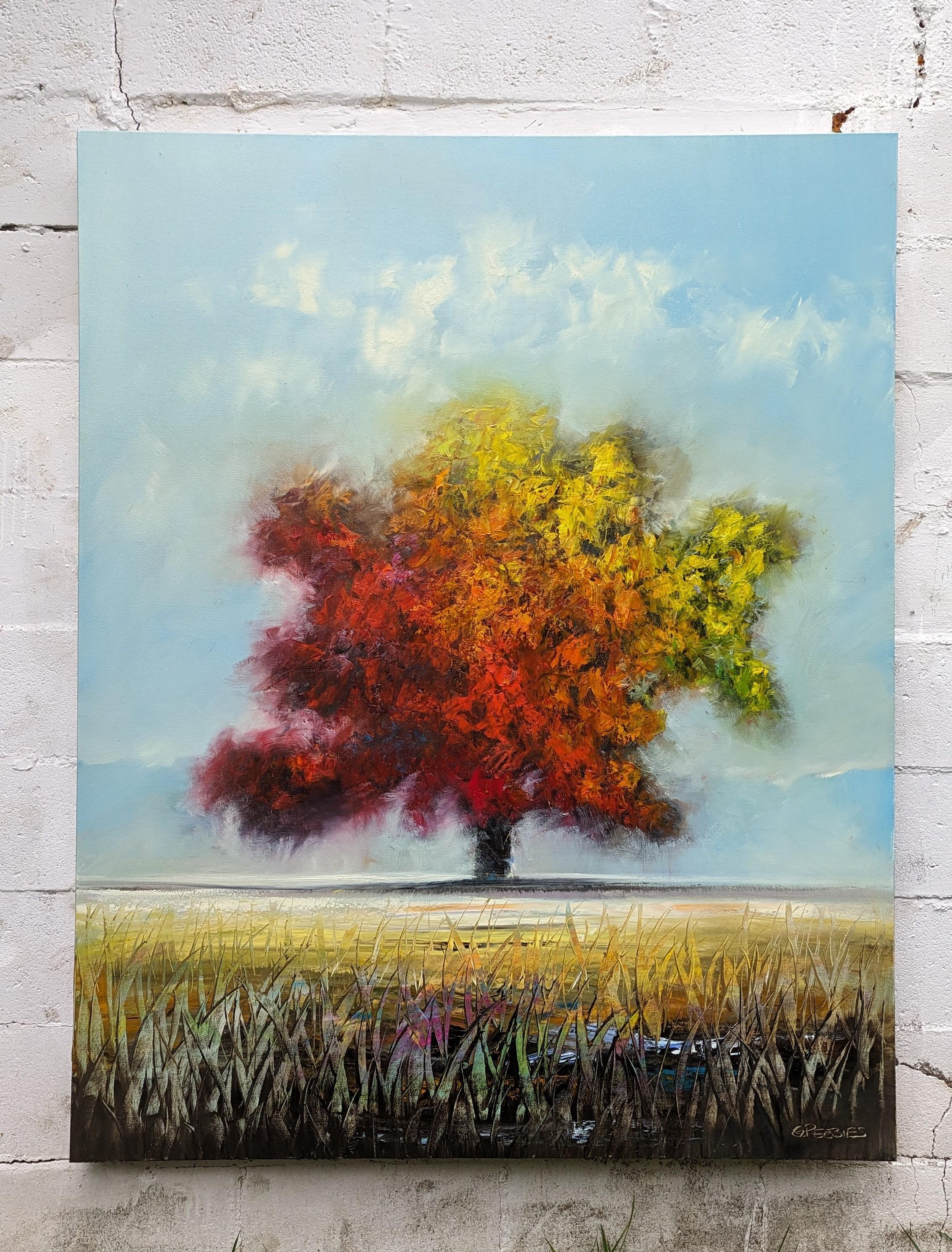 <p>Artist Comments<br>Artist George Peebles presents his interpretation of fall at its finest. The tree, adorned with red, orange, and yellow leaves, stands towering amid an expansive field. The tall, wispy grasses in the foreground create depth and