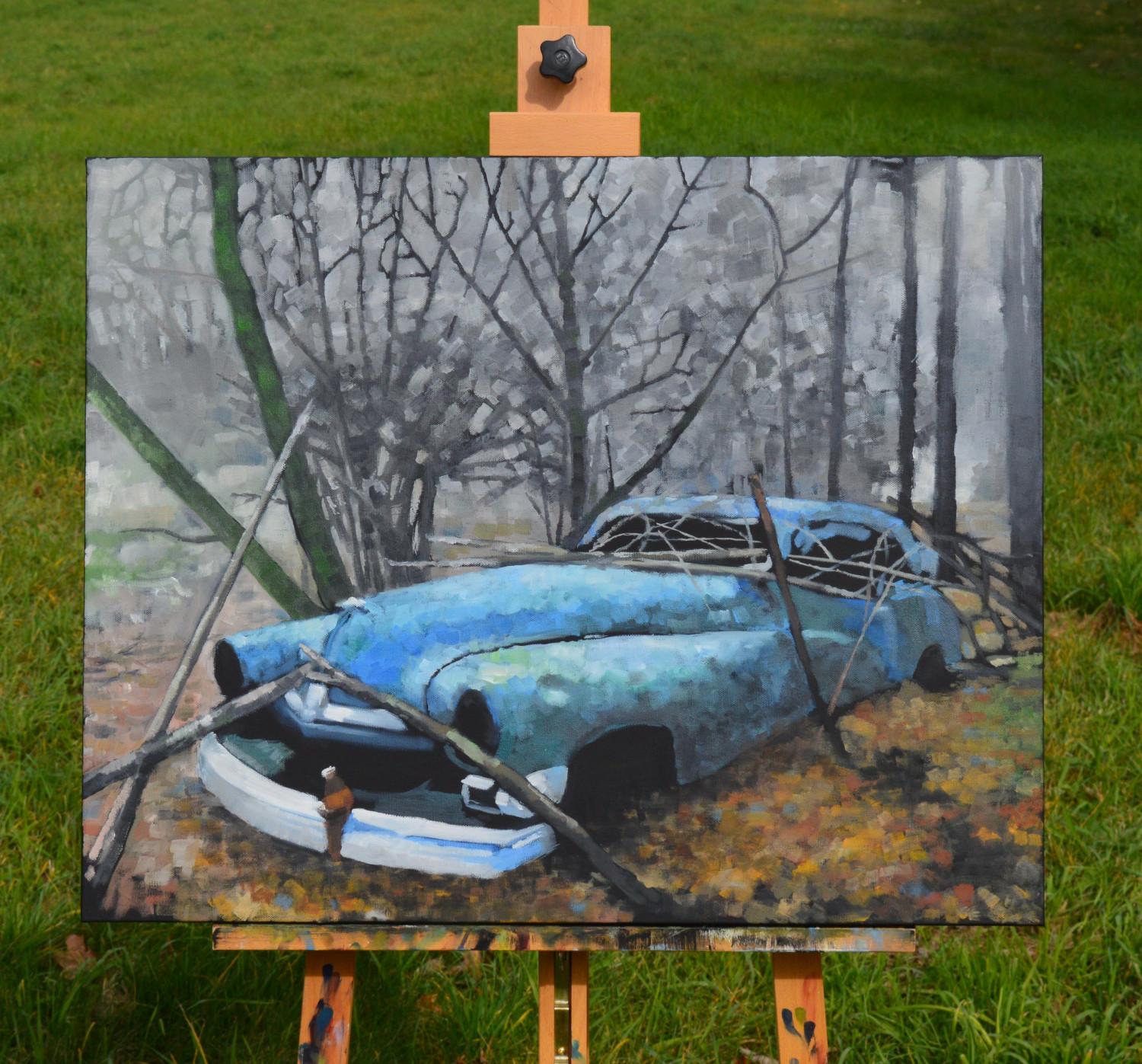 <p>Commentaires de l'artiste<br>Après avoir croisé une voiture bleue dans les bois au fil des ans, l'artiste David Thelen préserve la scène dans cette peinture intrigante. Des arbres dénudés peuplent la scène tandis qu'un tapis vibrant de feuilles