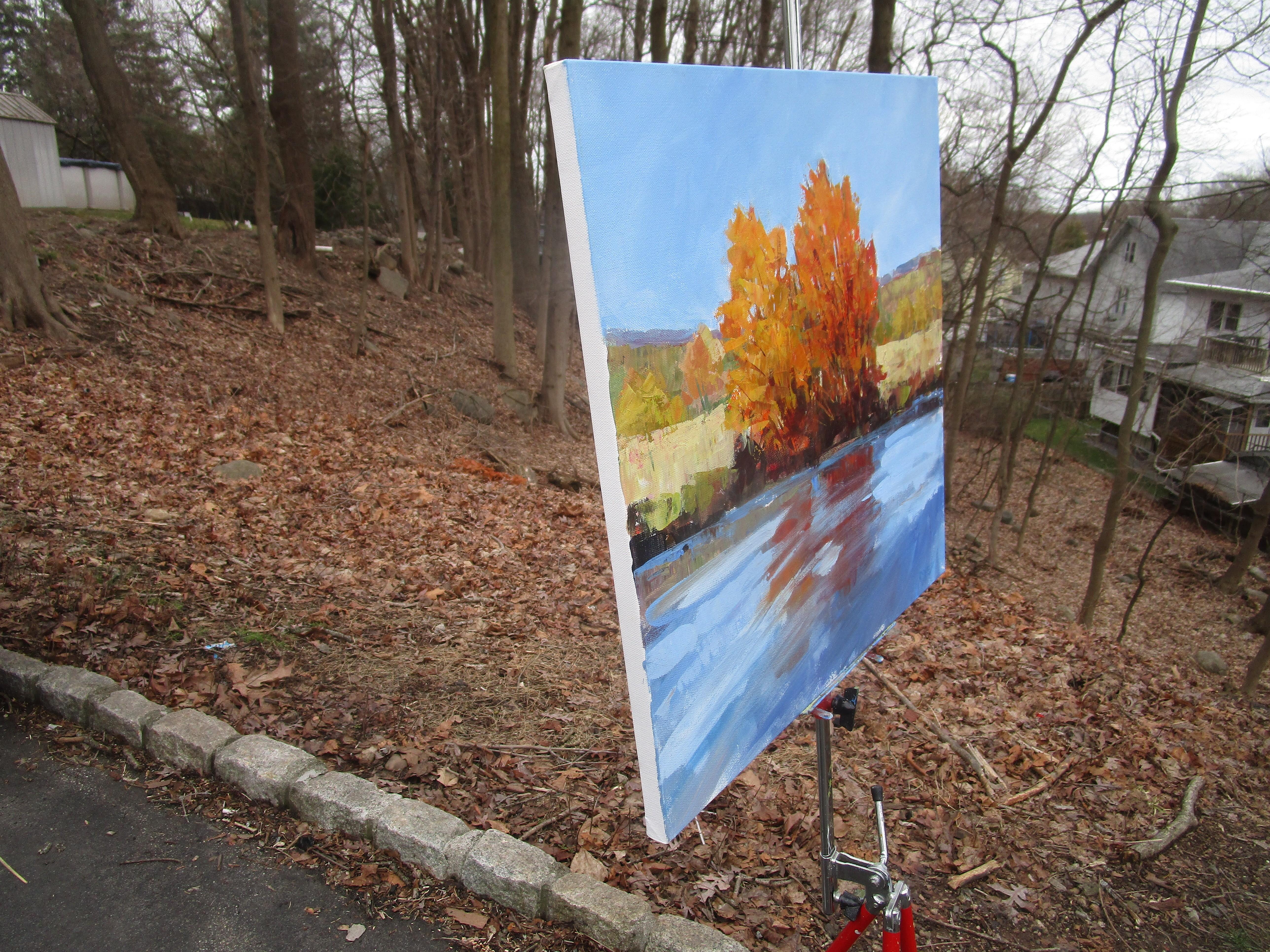 <p>Artist Comments<br>The fiery hues of the autumn trees contrast beautifully with the cool tones of the stream. The swift course of the water distorts the reflection of the gently rustling leaves. The composition conveys a sense of harmony between