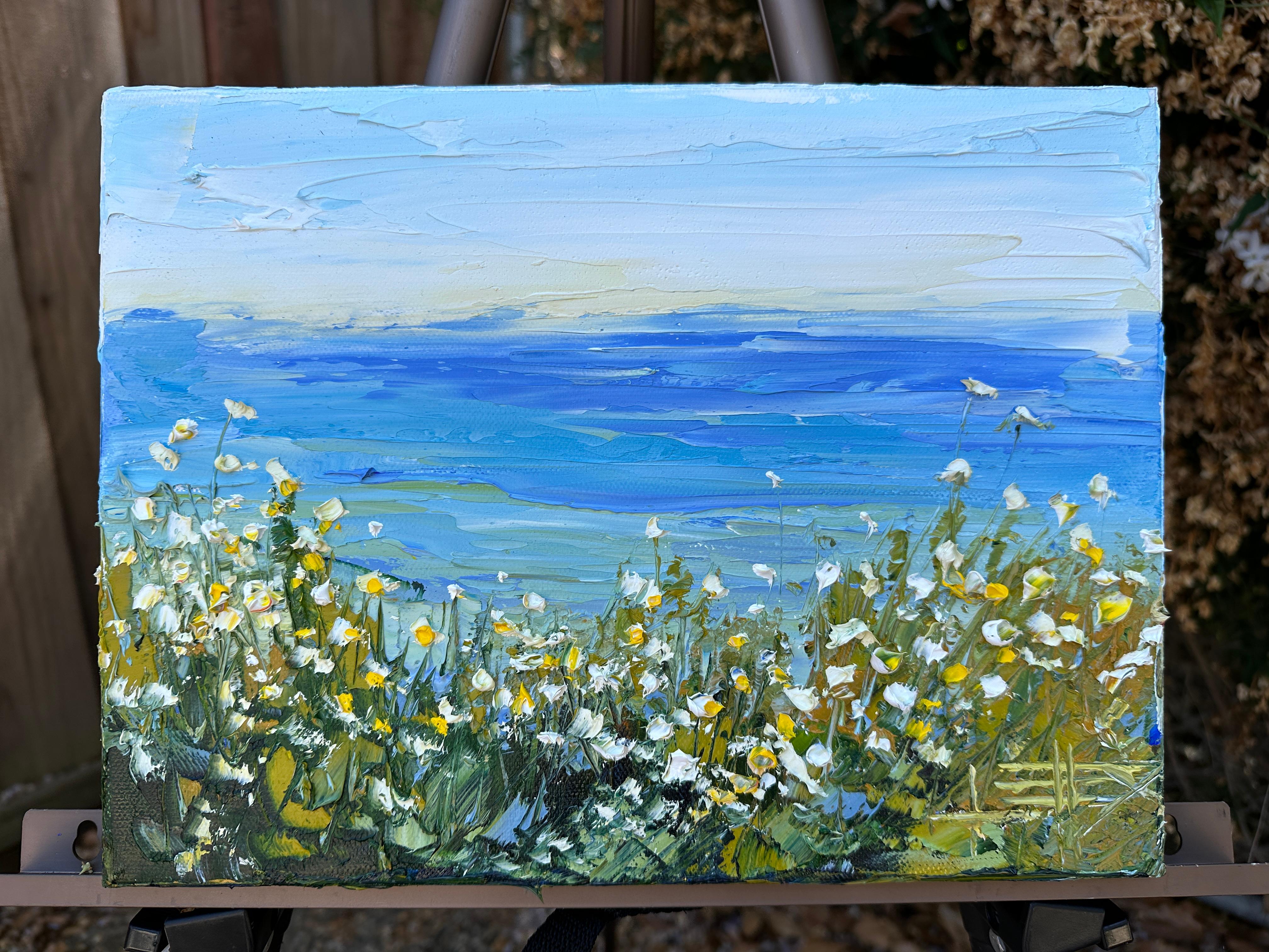 <p>Artist Comments<br>Wildflowers sway with the sea breeze, their vibrant petals complementing the blueness of the sky and water. Painted en plein air, artist Lisa Elley captures the picturesque view of Monterey Bay in California, where the gentle
