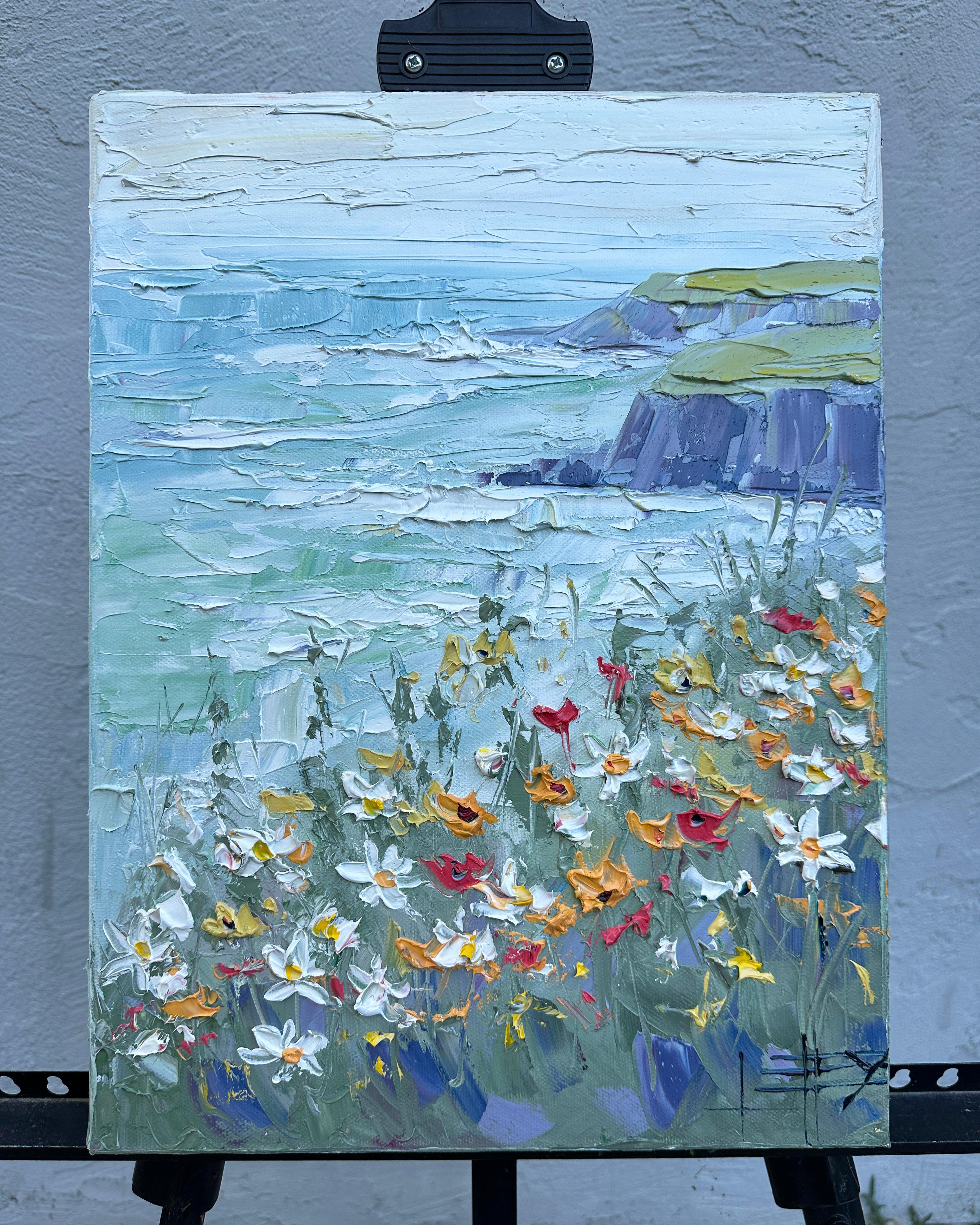 <p>Artist Comments<br />Bright wildflowers bloom in the foreground while the waves crash against the cliffs in the distance. The sky, painted in soft blues and whites, merges seamlessly with the Pacific Ocean. The thick paint captures the varied