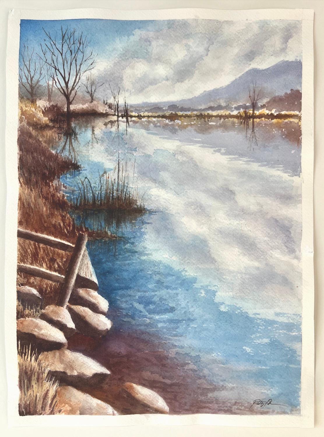 <p>Artist Comments<br>Golds, reds, and plums capture the brilliance of fall at Coot Lake in Colorado. The water mirrors its surroundings, reflecting billowing clouds and distant mountains. Rocks and a weathered fence in the foreground add rustic